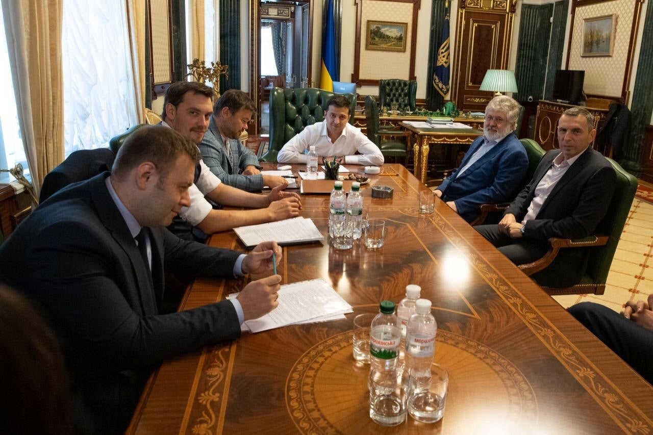 Volodymr Zelensky (centre) has courted scandal with his public embrace of the controversial oligarch Ihor Kolomoisky (seated to his left), who has been explicit in his threats to former central bank chief Valeria Gontareva.