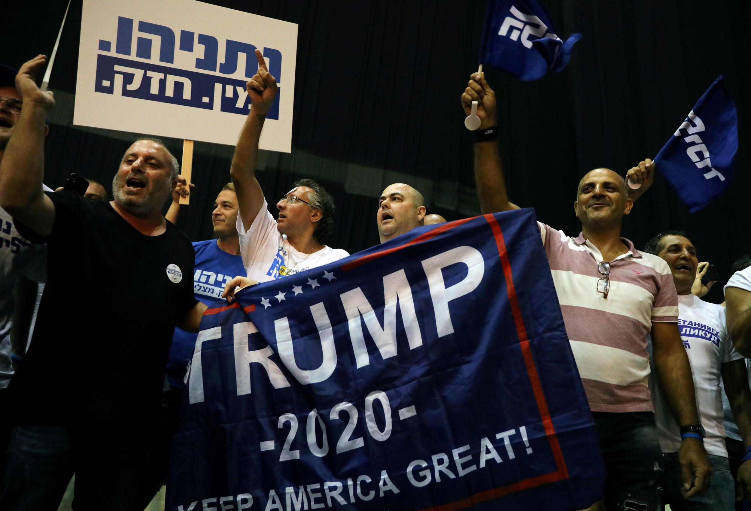 Supporters of the Likud party react to exit polls in Israel’s parliamentary election at the party headquarters in Tel Aviv (Reuters/Ammar Awad)