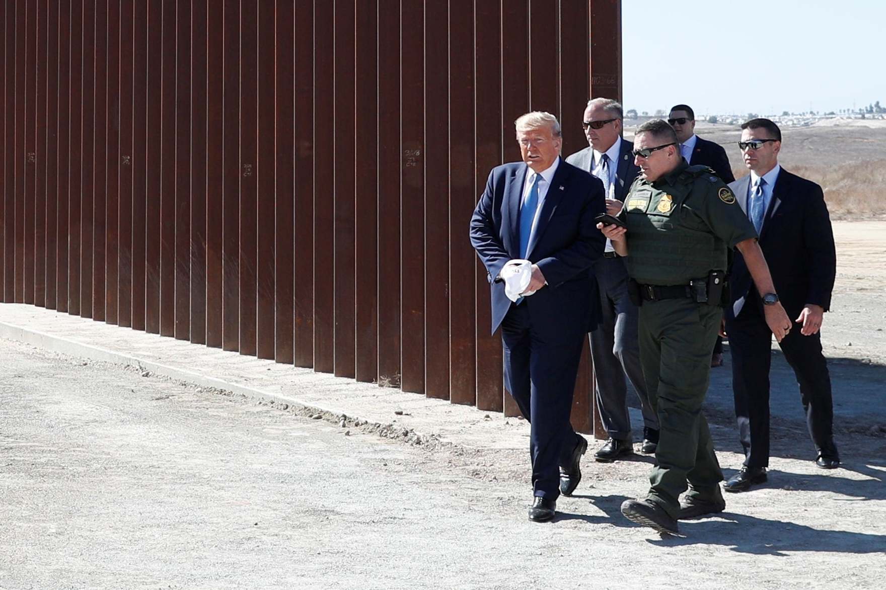 Donald Trump visits a section of the U.S.-Mexico border wall in Otay Mesa, California