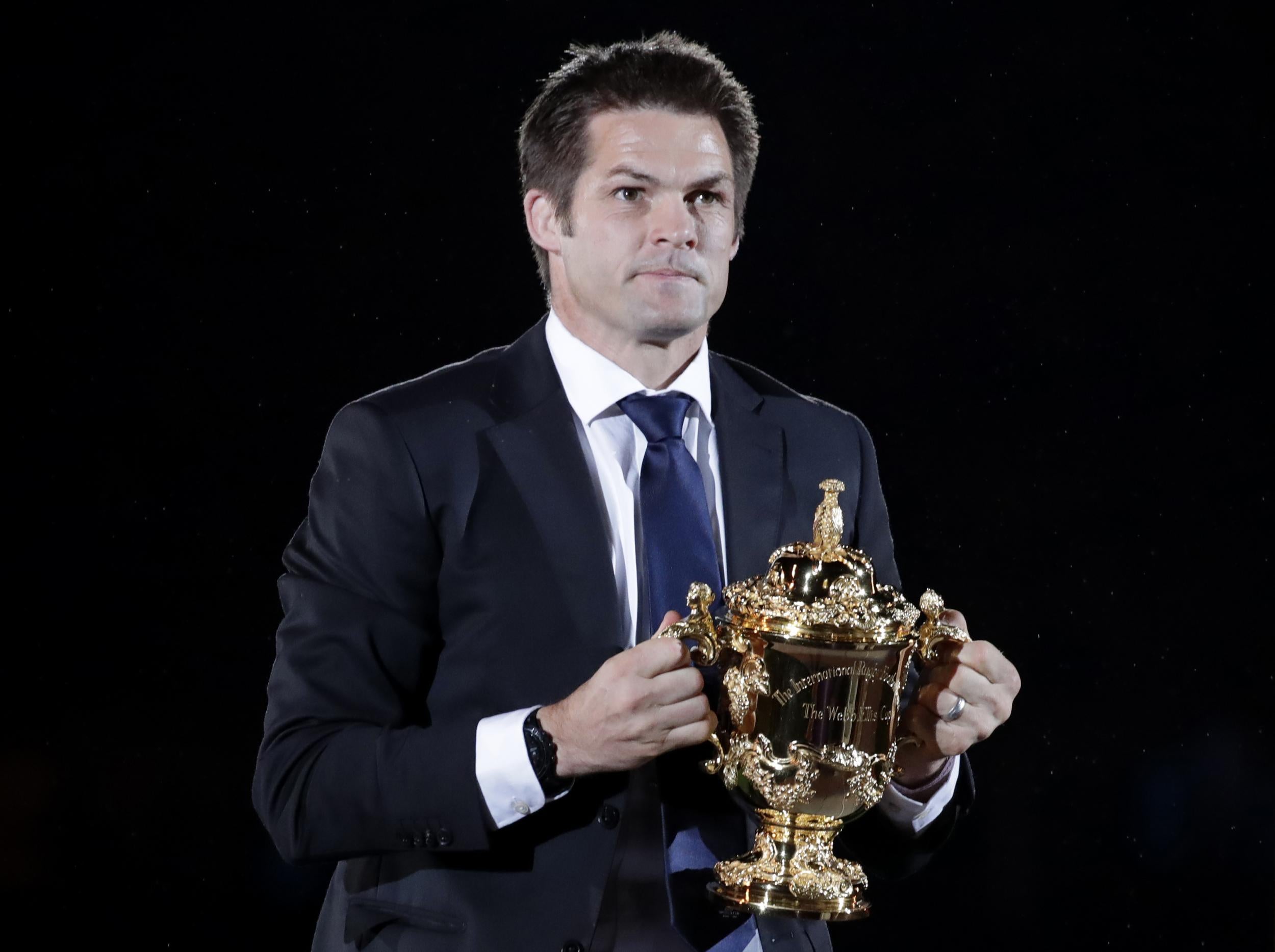 Richie McCaw arrives with the Webb Ellis Cup