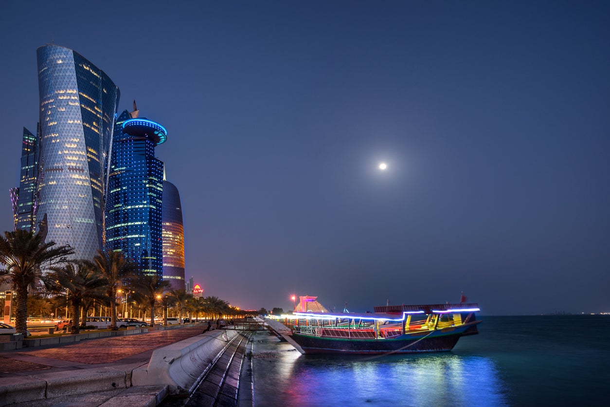 See the West Bay by night on a Dhow boat