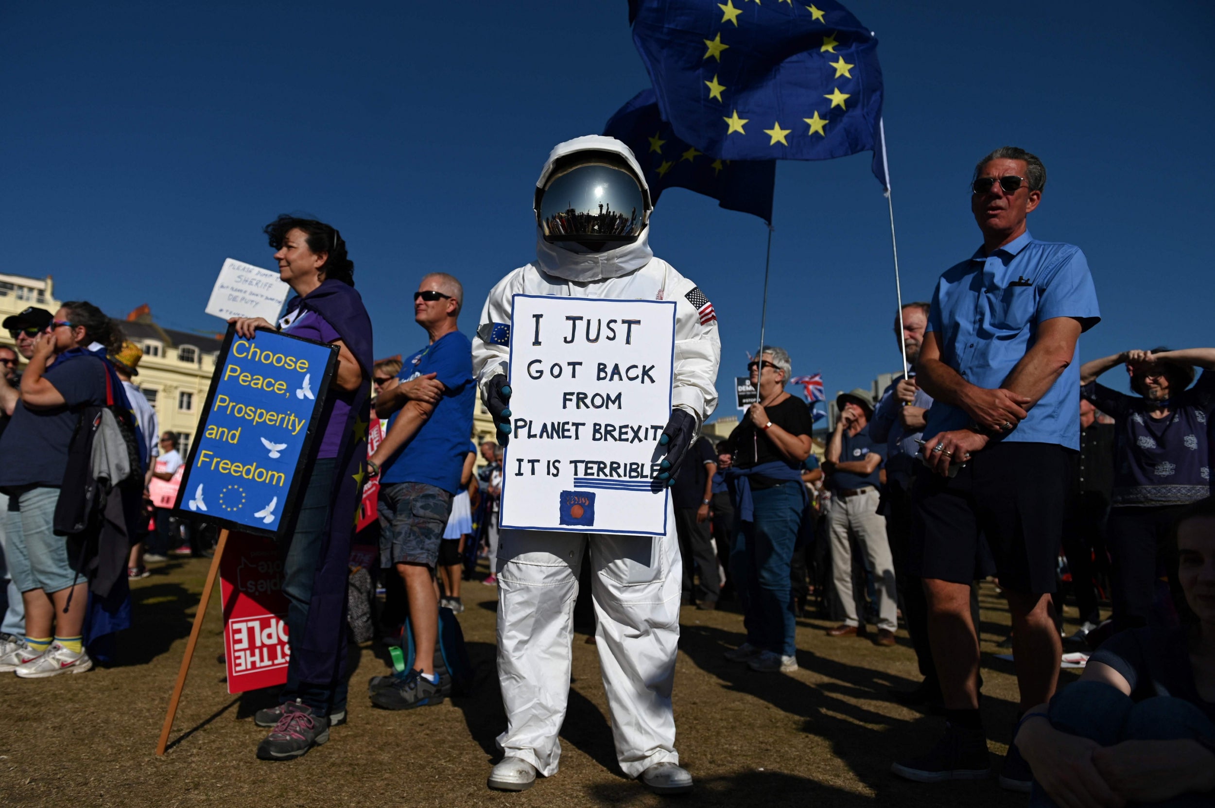 A disapproving astronaut-protester in Brighton last month