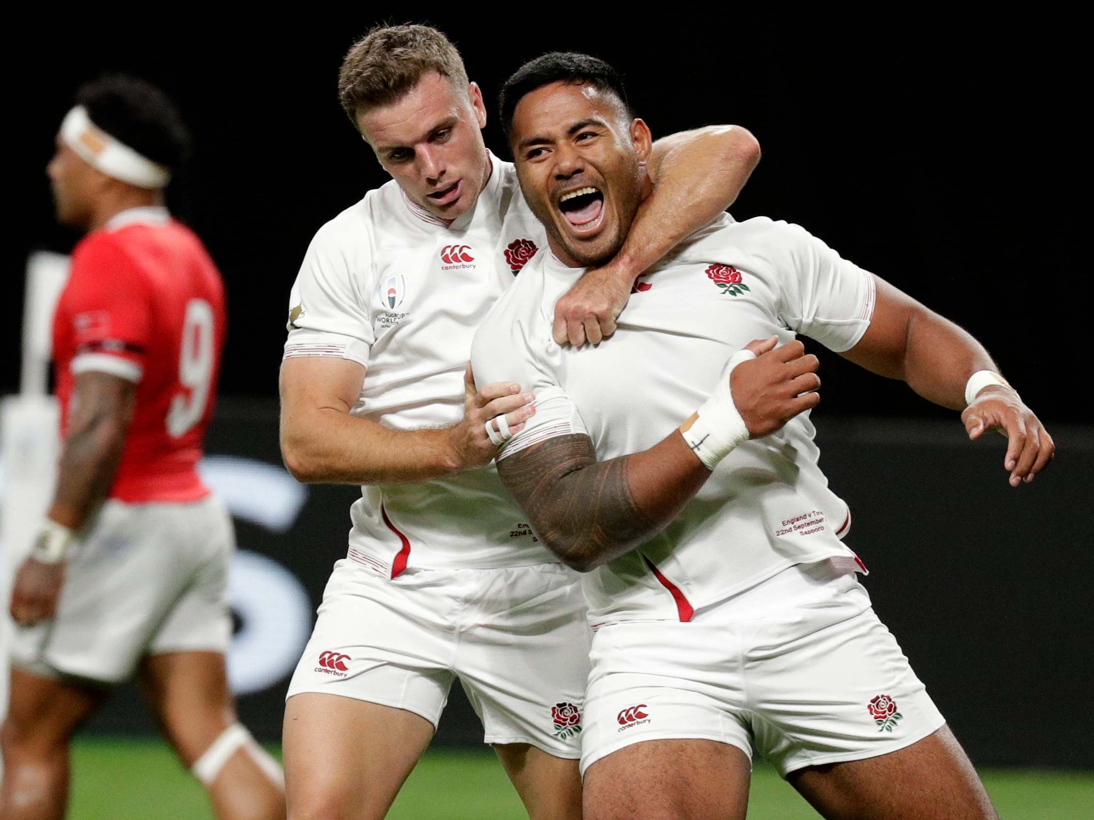 England's Manu Tuilagi is congratulated by teammate George Ford after scoring England's first