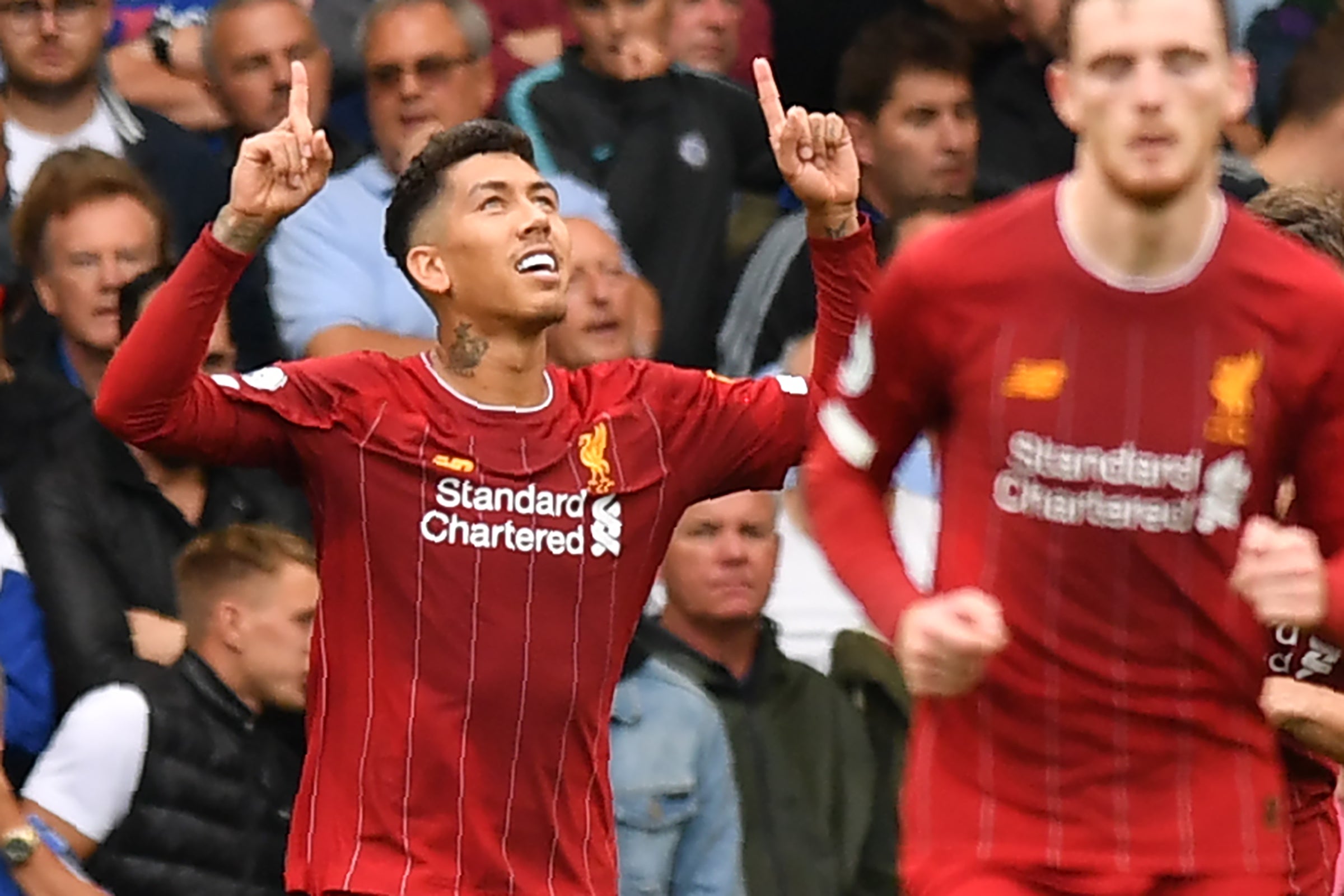 Firmino celebrates after doubling the lead for Liverpool