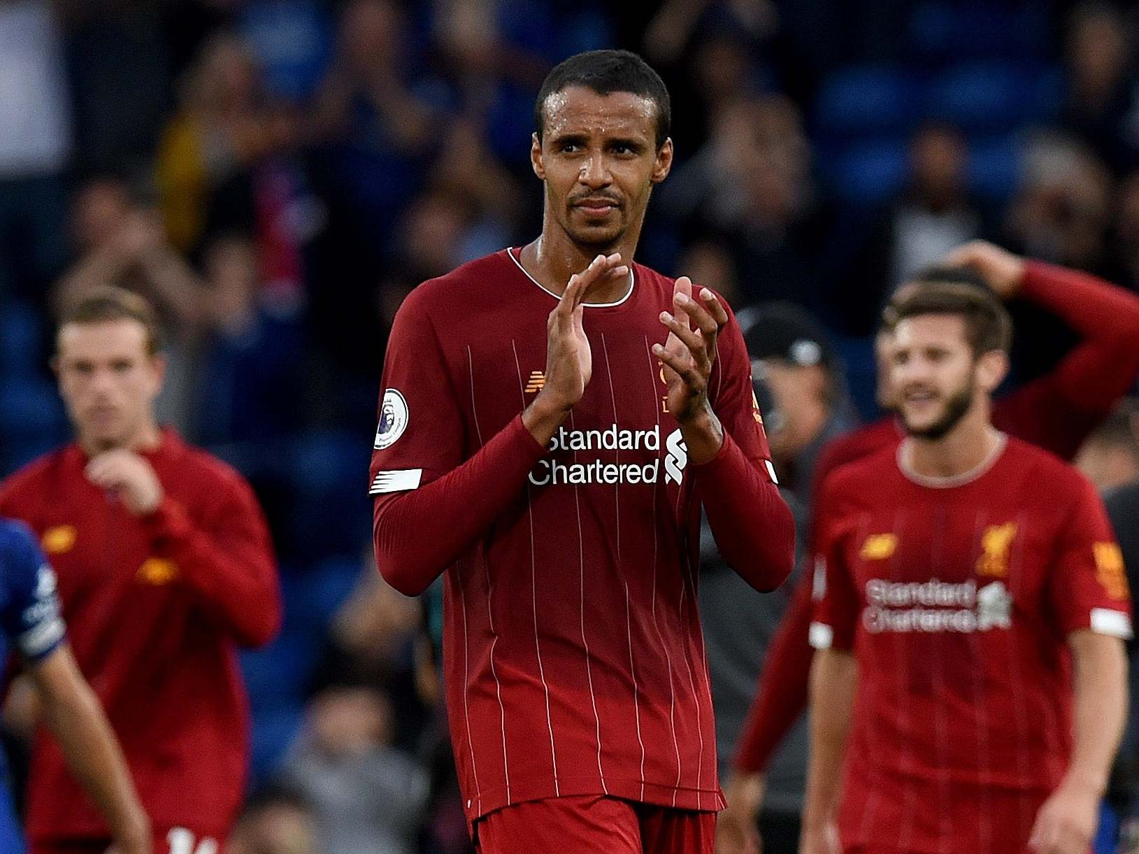 Joel Matip of Liverpool showing his appreciation to the fans