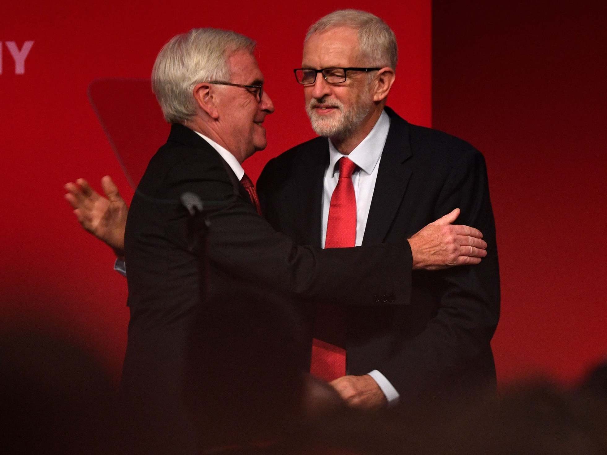 McDonnell is greeted by Corbyn before delivering his speech