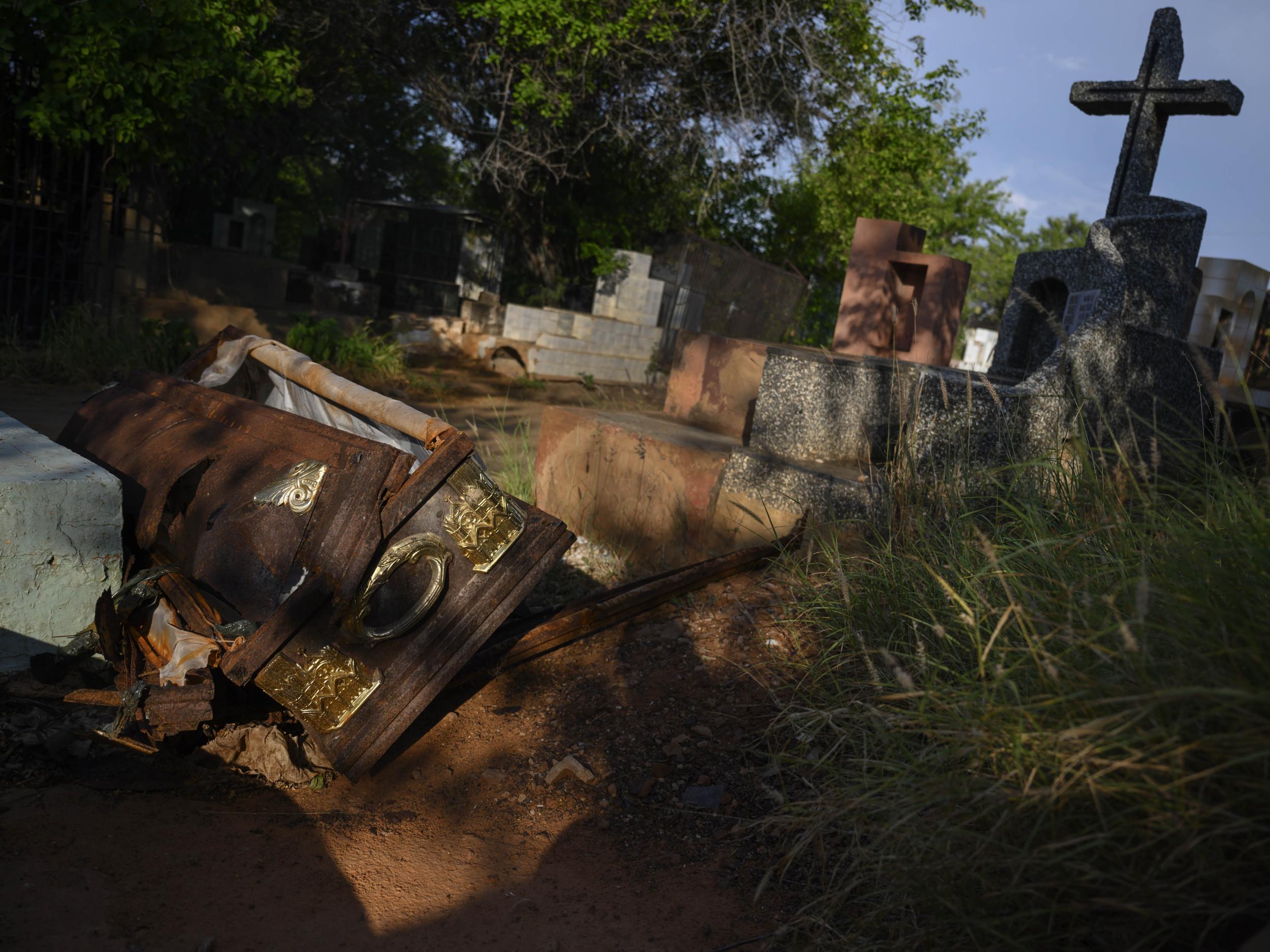 A coffin opened by grave robbers at the Sagrado Corazon de Jesus in Venezuela