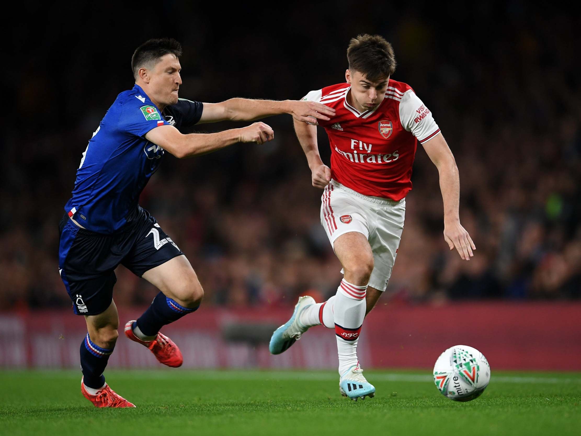 Kieran Tierney bursts away from Forest's Joe Lolley