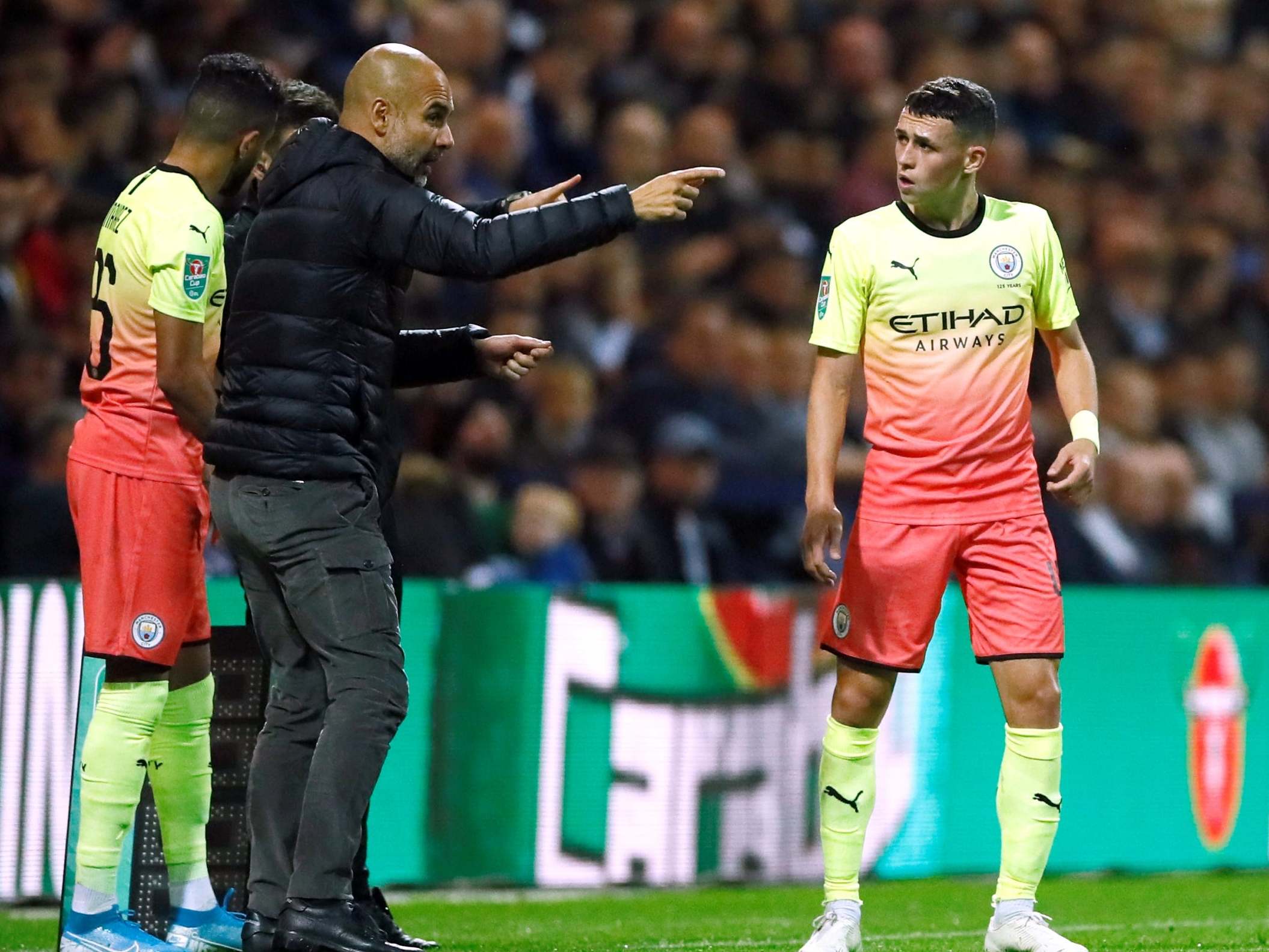 Pep Guardiola instructs Phil Foden at Preston