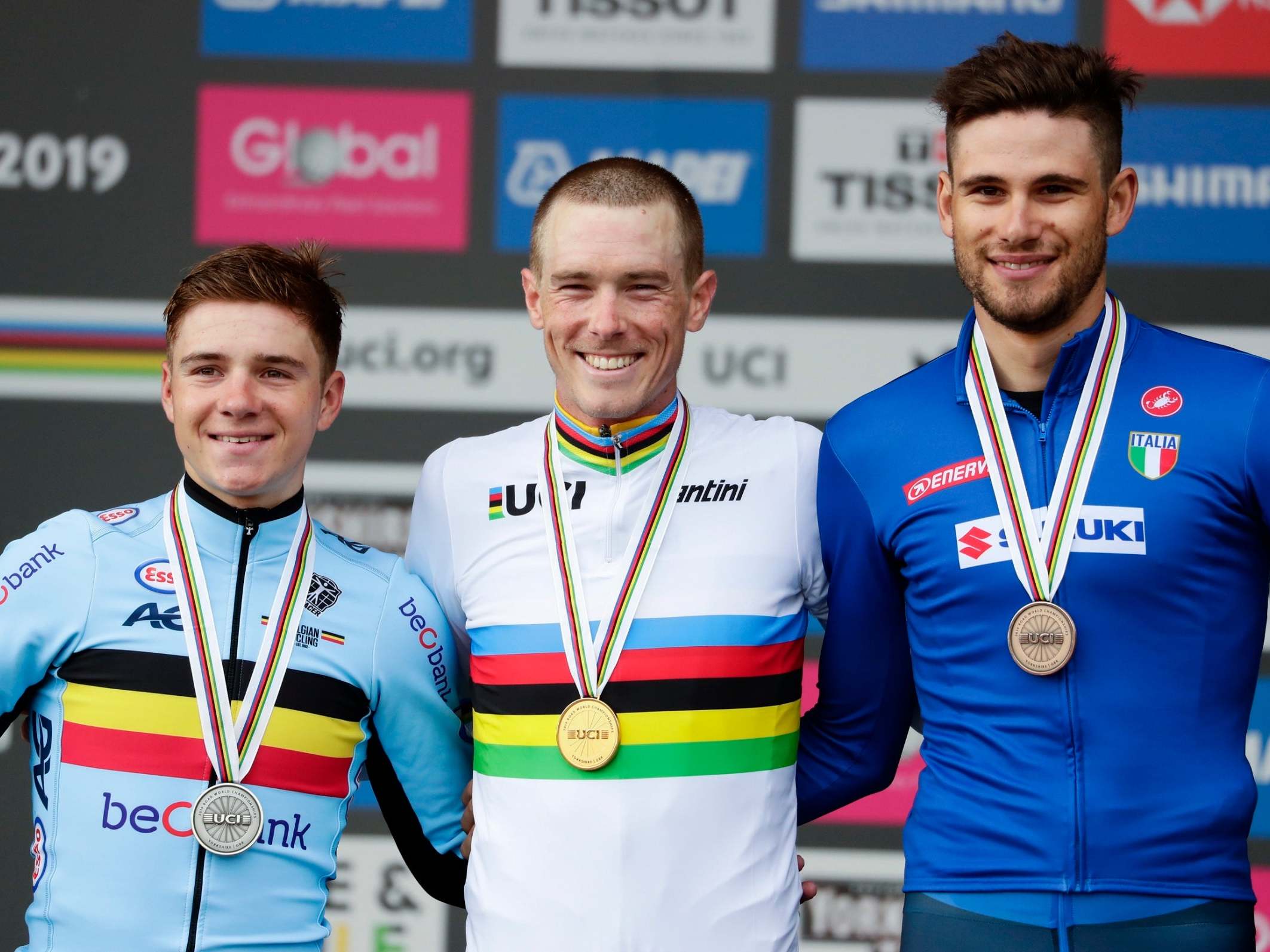 Rohan Dennis, centre, beat second-place Remco Evenepoel, left