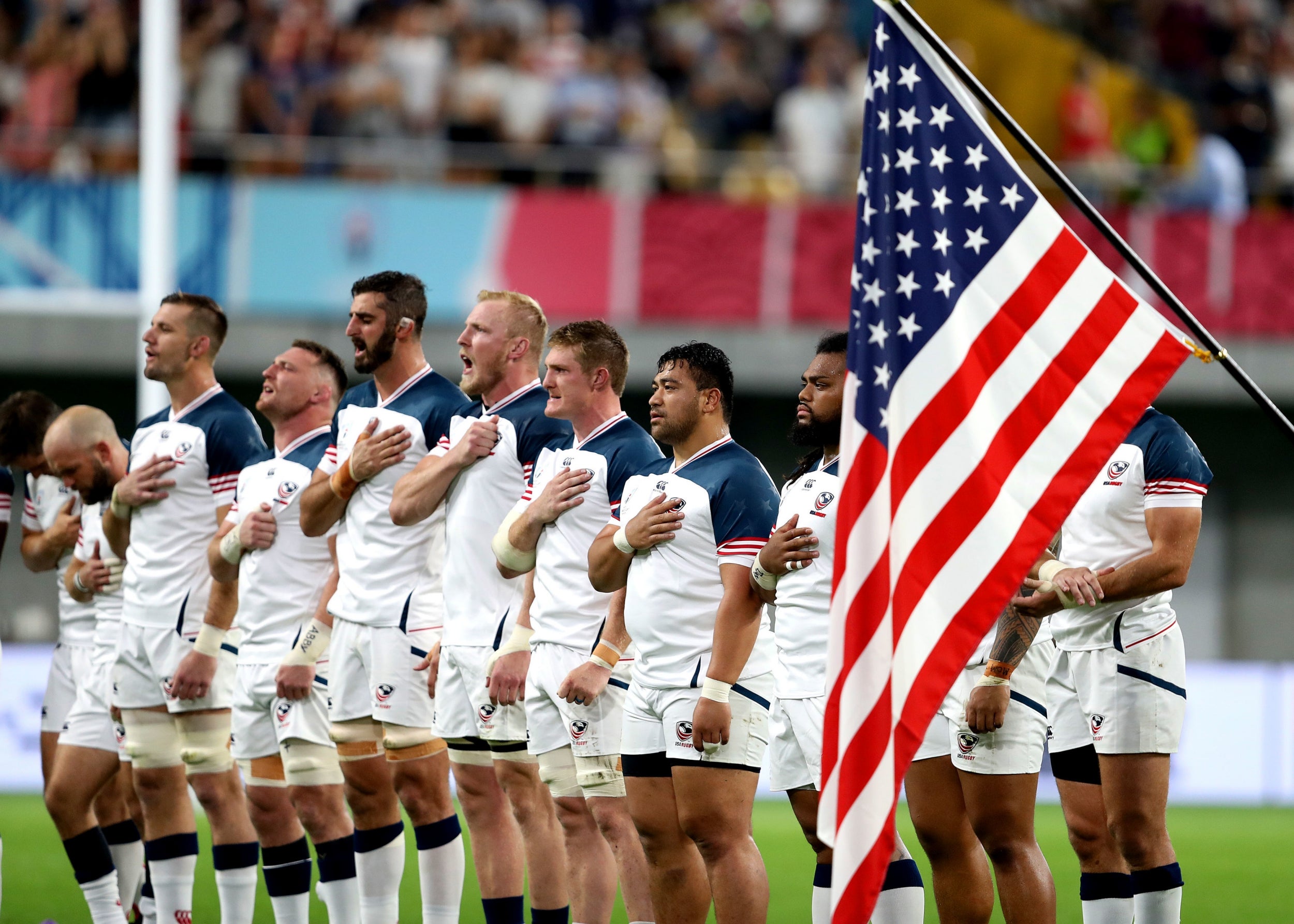 The US players sing their national anthem prior to kick-off