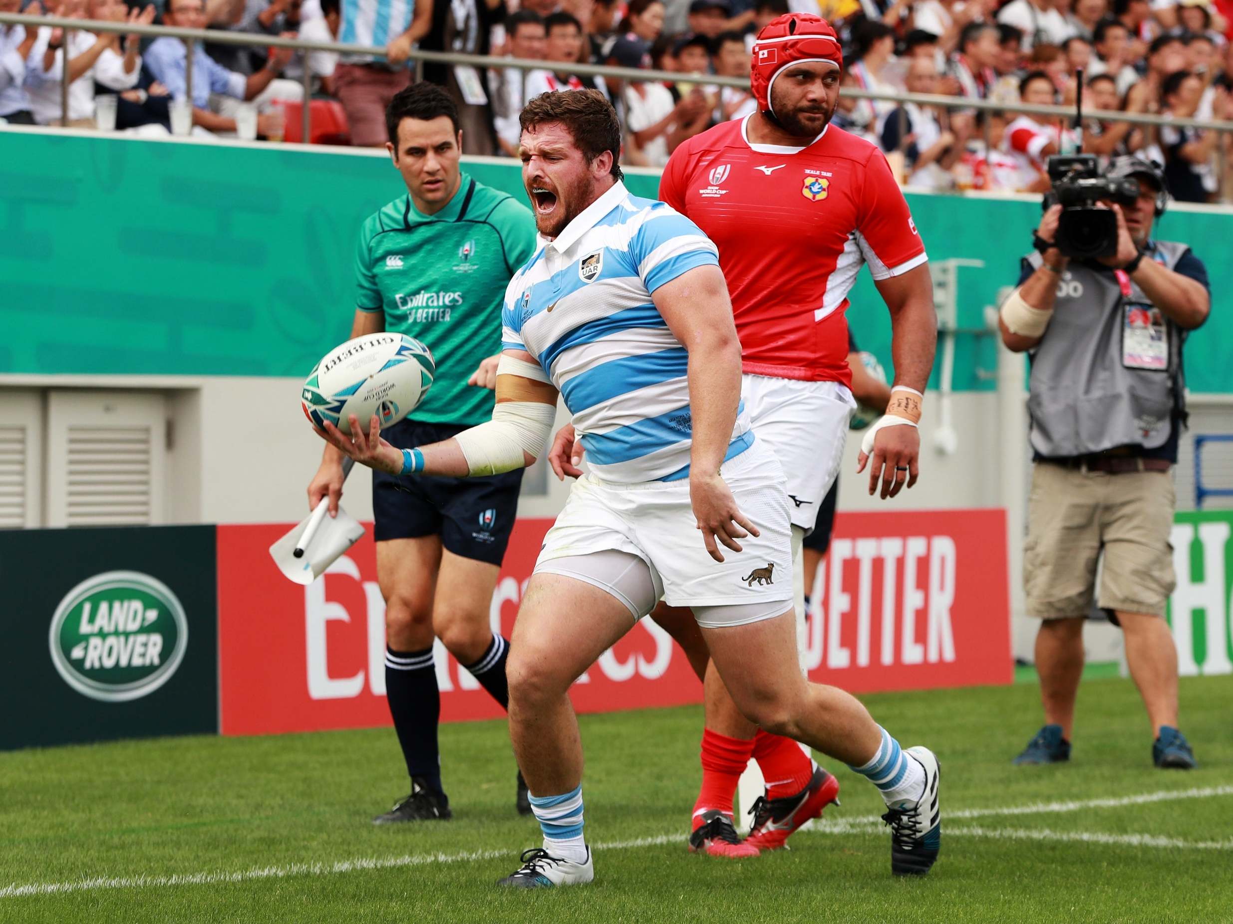 Julian Montoya celebrates the first of his three tries against Tonga