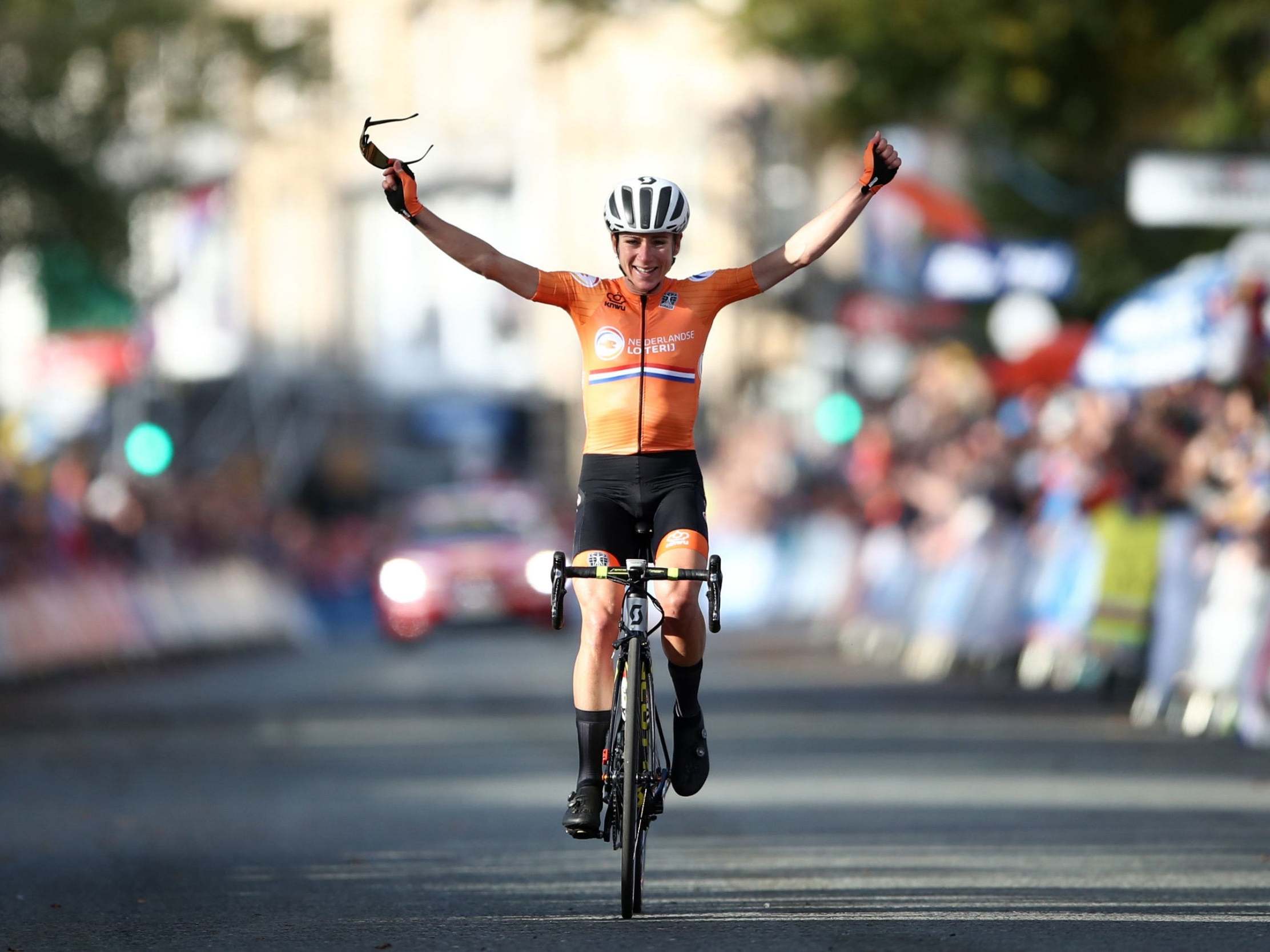 Annemiek van Vleuten celebrates as she crosses the finish line