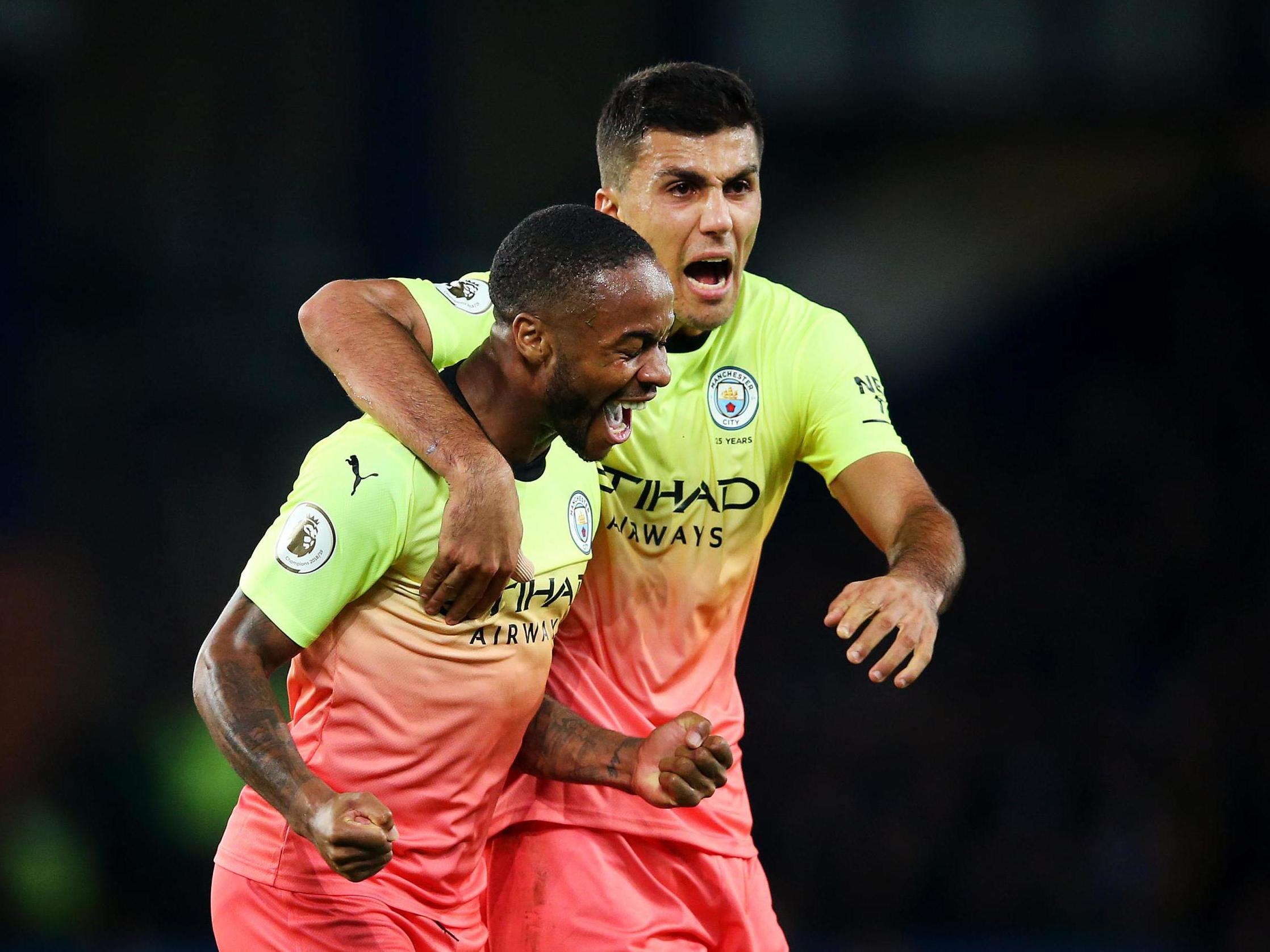 Raheem Sterling celebrates scoring Manchester City's third