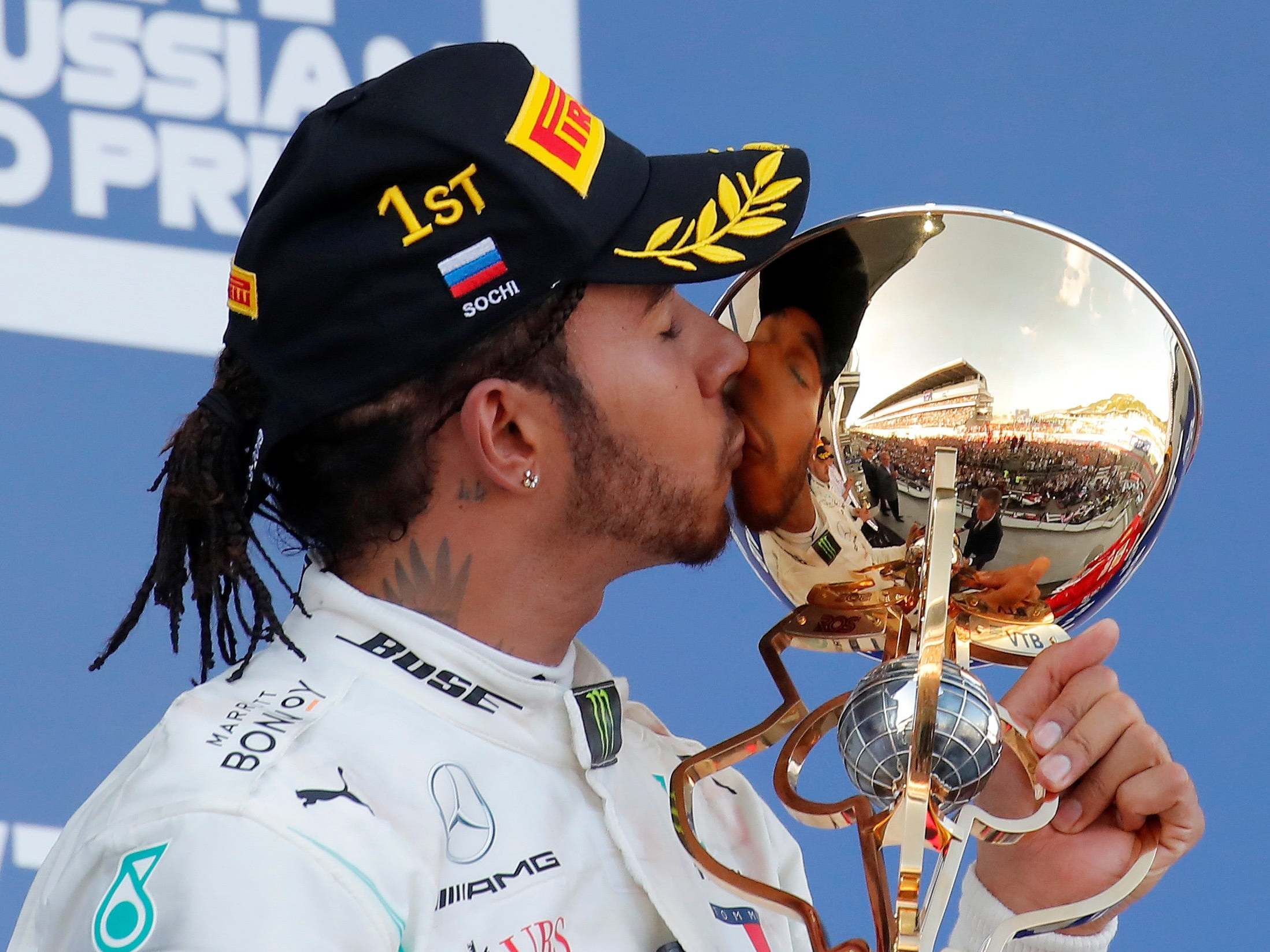 Lewis Hamilton celebrates on the podium