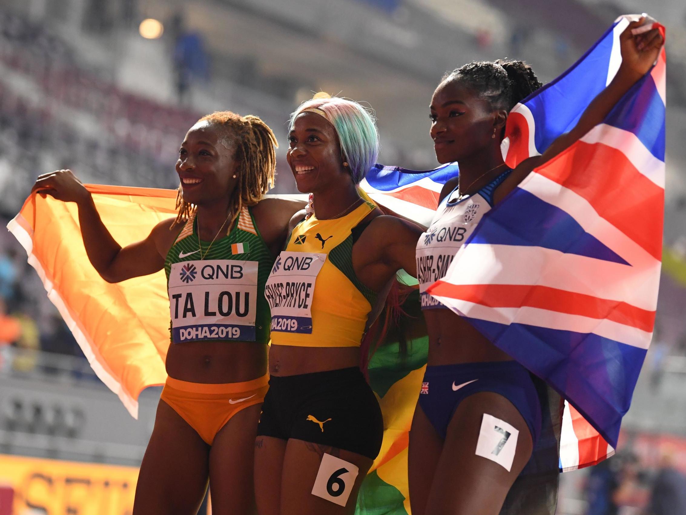 The medallists celebrate after the race in Doha