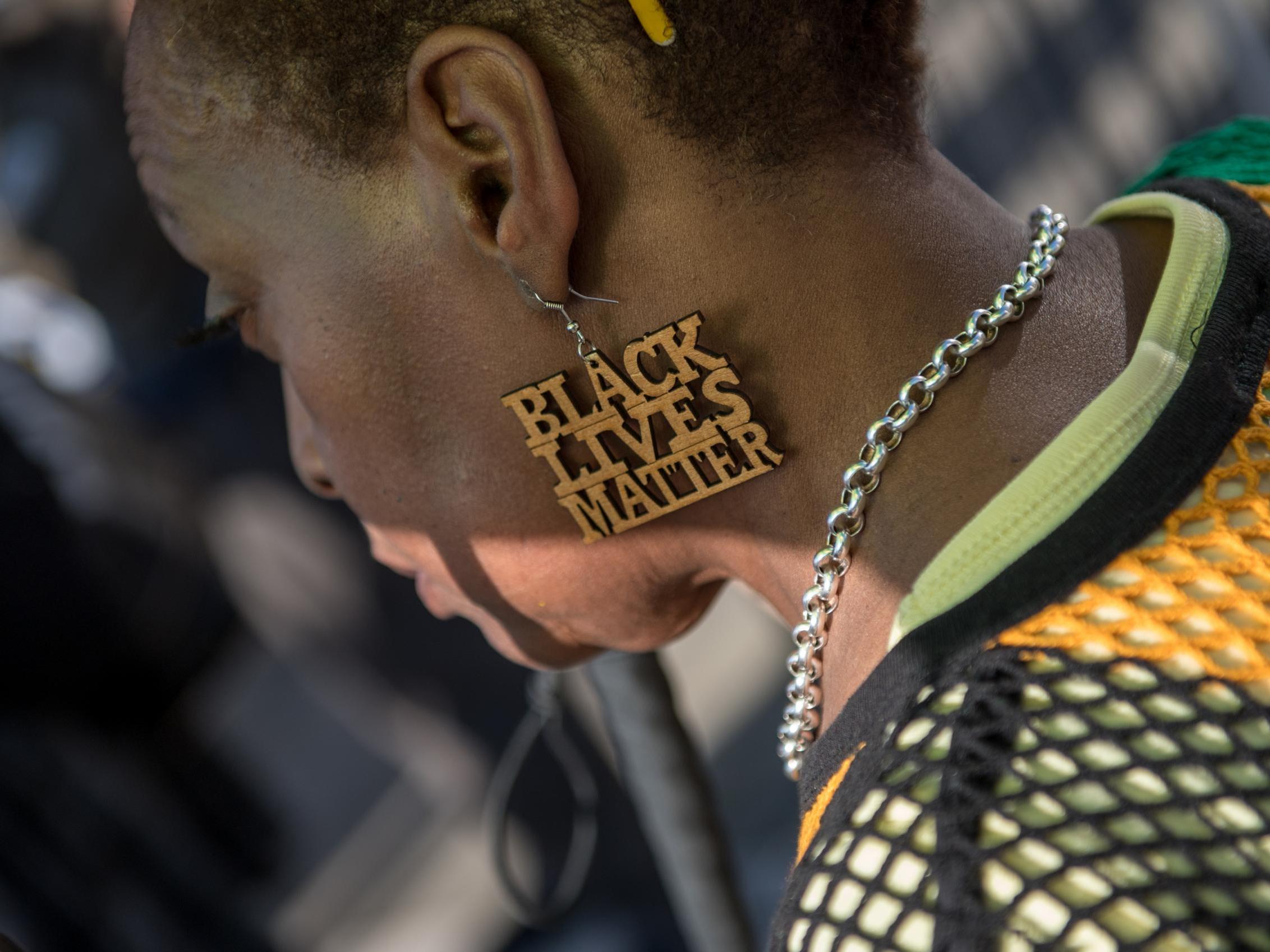 A demonstrator at a protest in support of the Windrush generation in Brixton, London, 20 April 2018