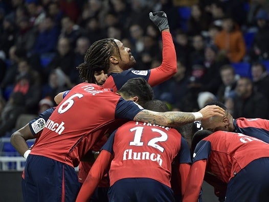 Loic Remy celebrates scoring for Lille against Lyon