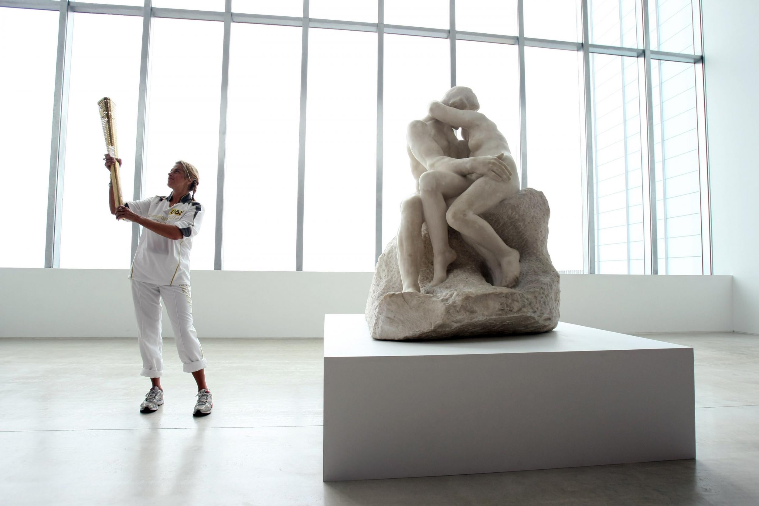 Tracey Emin held the Olympic Flame inside the Turner alongside 'The Kiss' in 2012