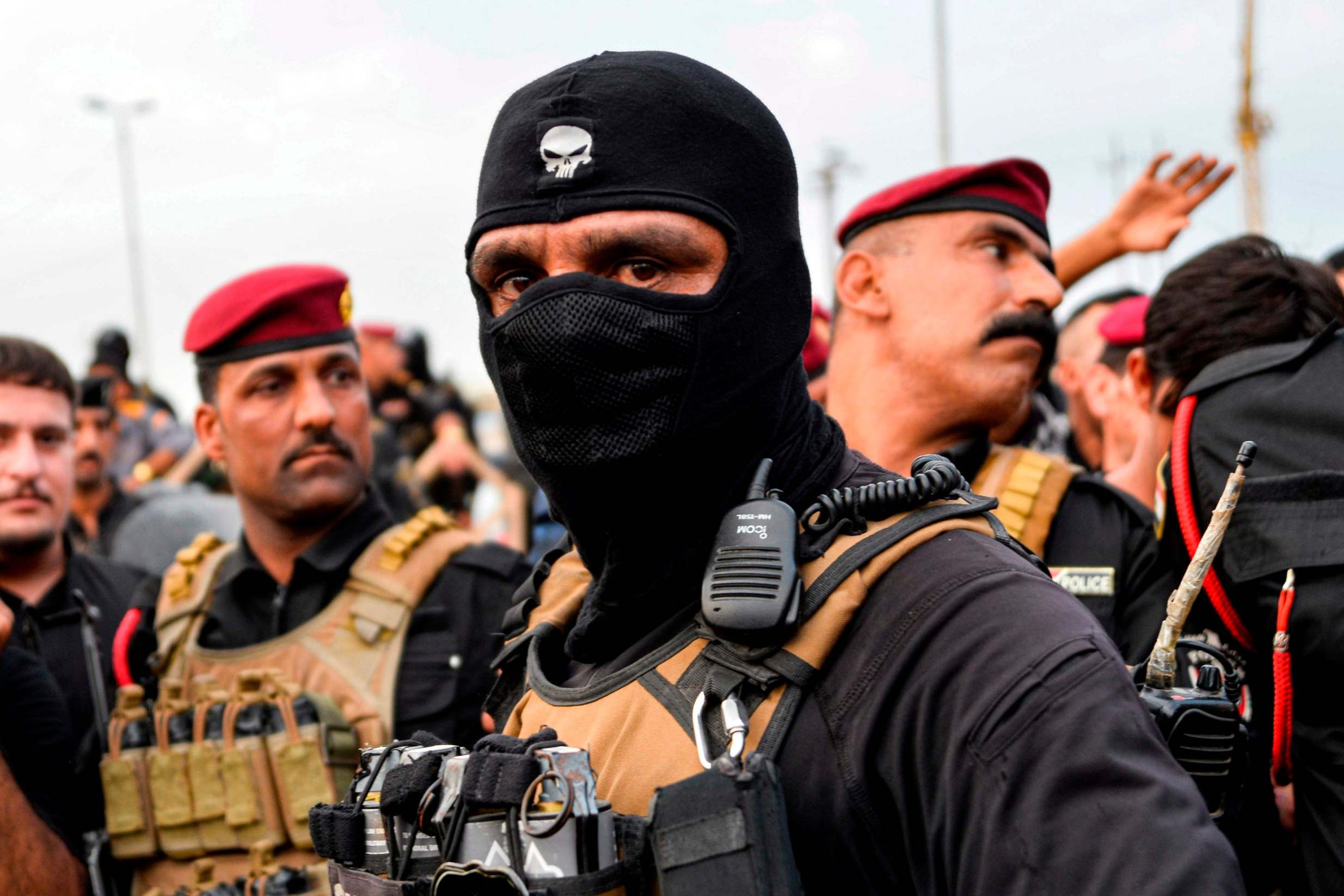 Iraqi security forces confront protesters during a demonstration in the central Iraqi shrine city of Najaf (AFP/Getty)