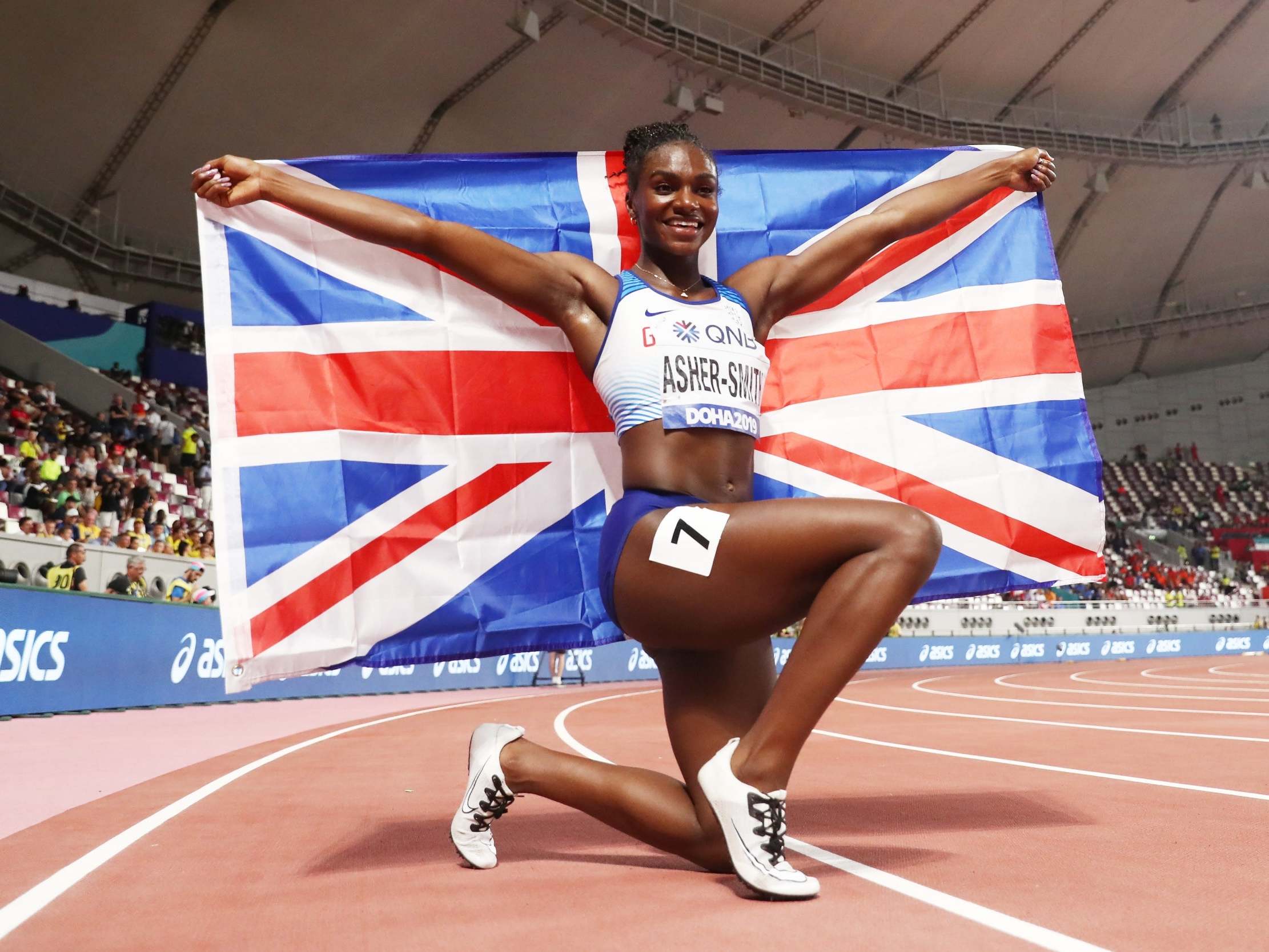 Asher-Smith celebrates winning gold in the 200m