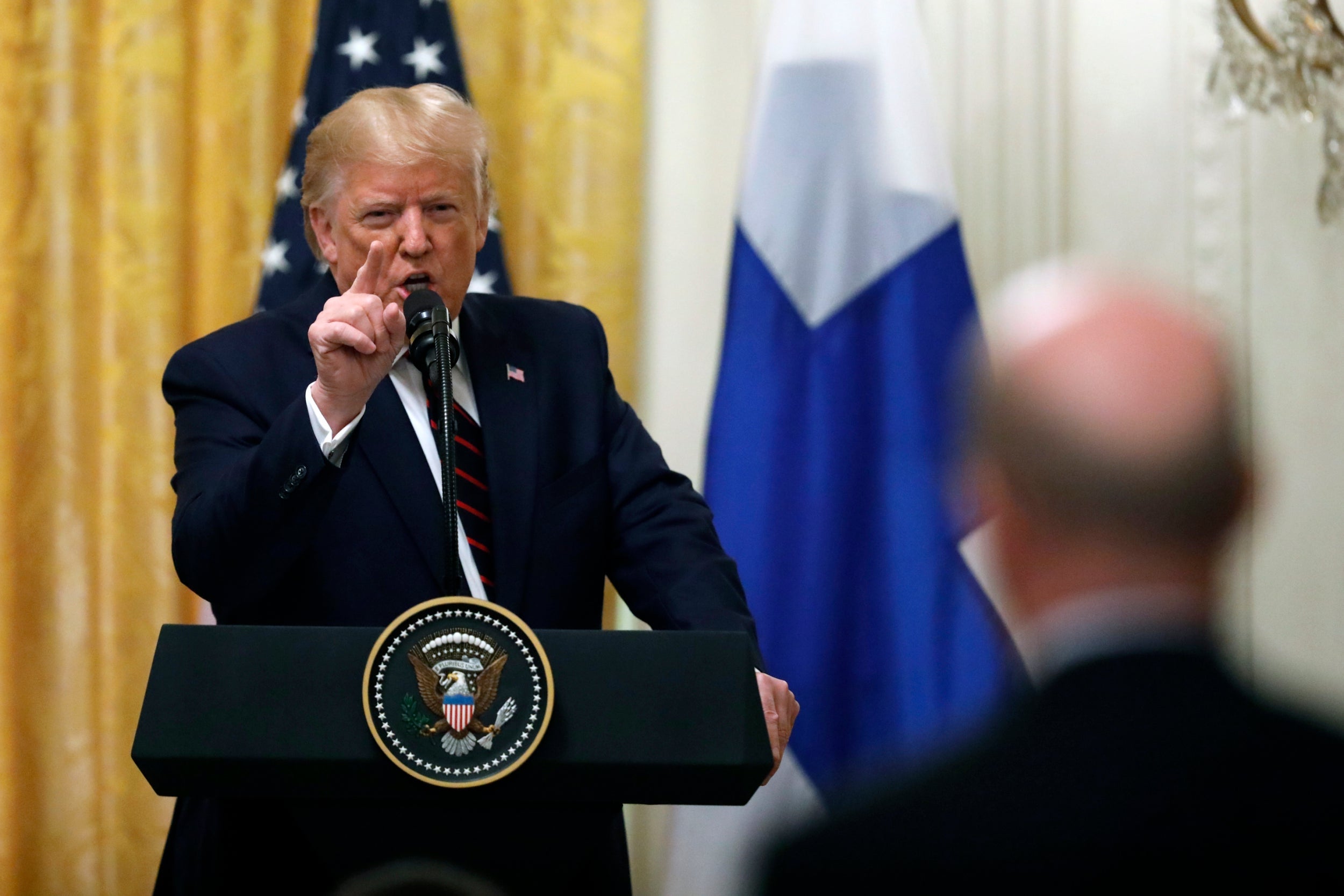 President Donald Trump remonstrates with Reuters reporter Jeff Mason after being pressed on a question about Ukraine at a press conference at the White House (AP)