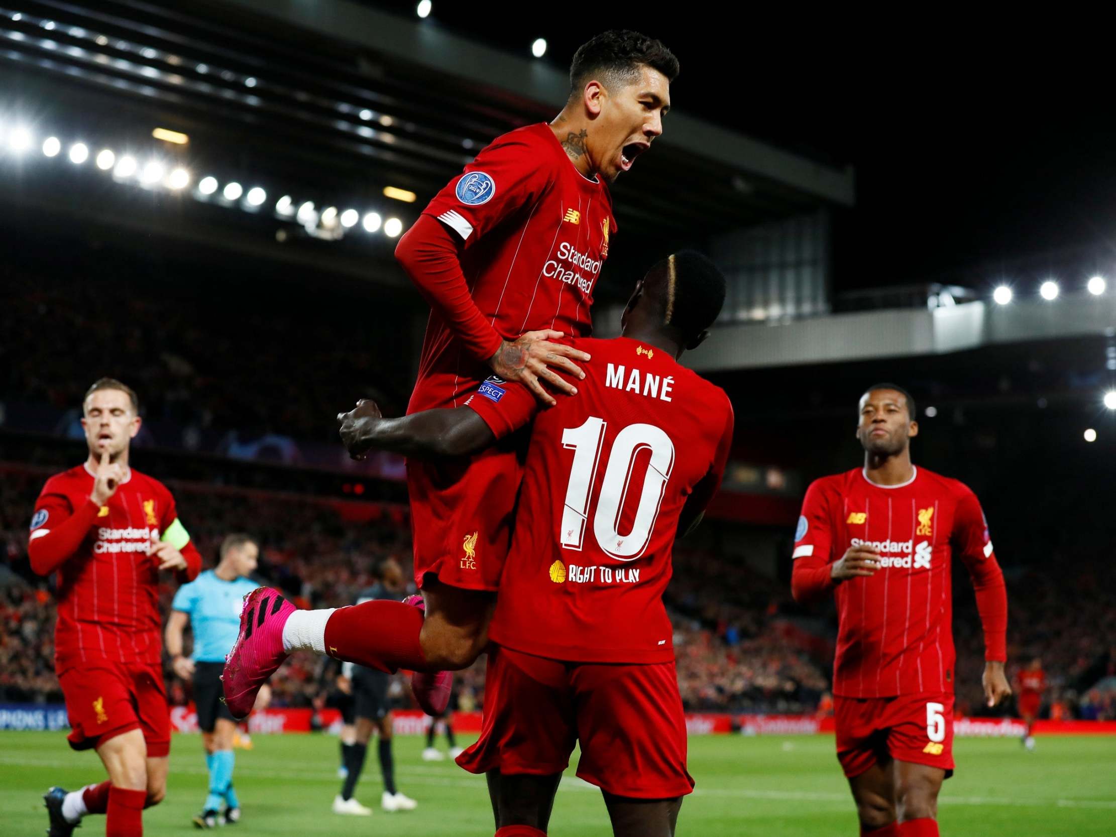 Roberto Firmino celebrates after teeing up Sadio Mane's opener