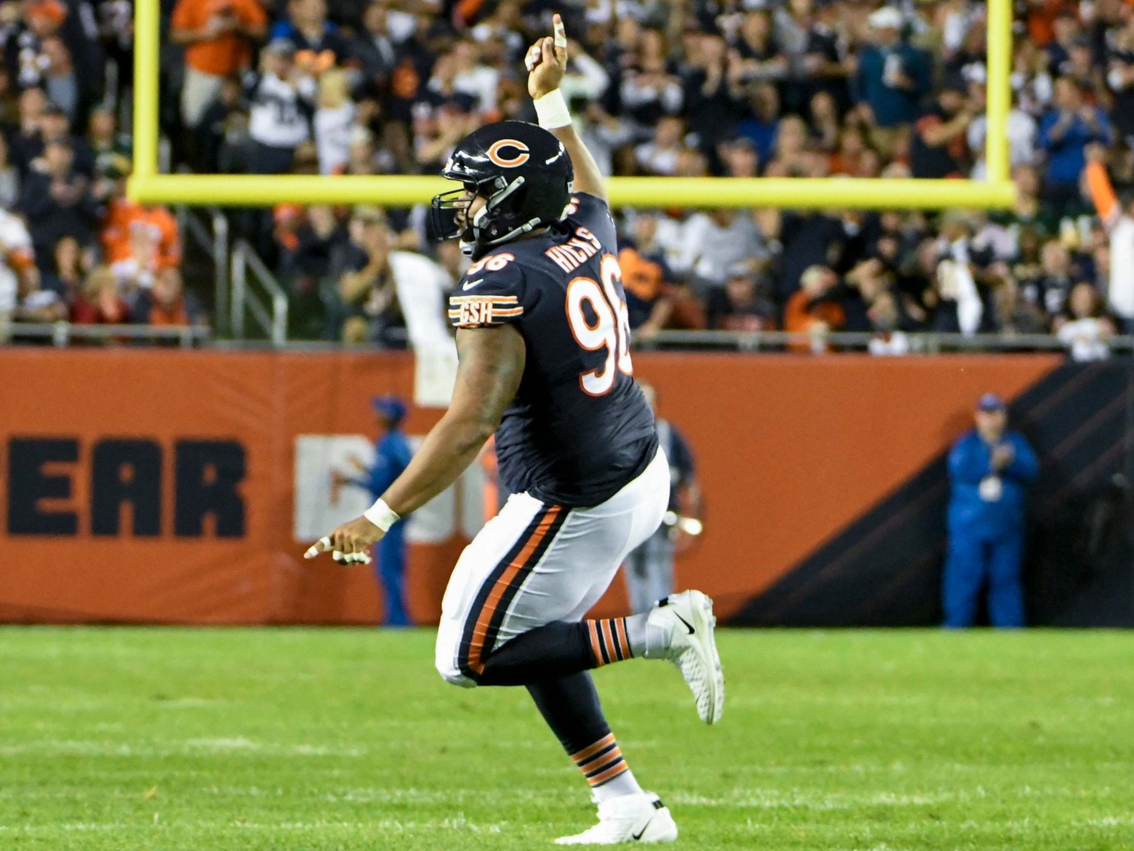 Akiem Hicks celebrates against the Green Bay Packers