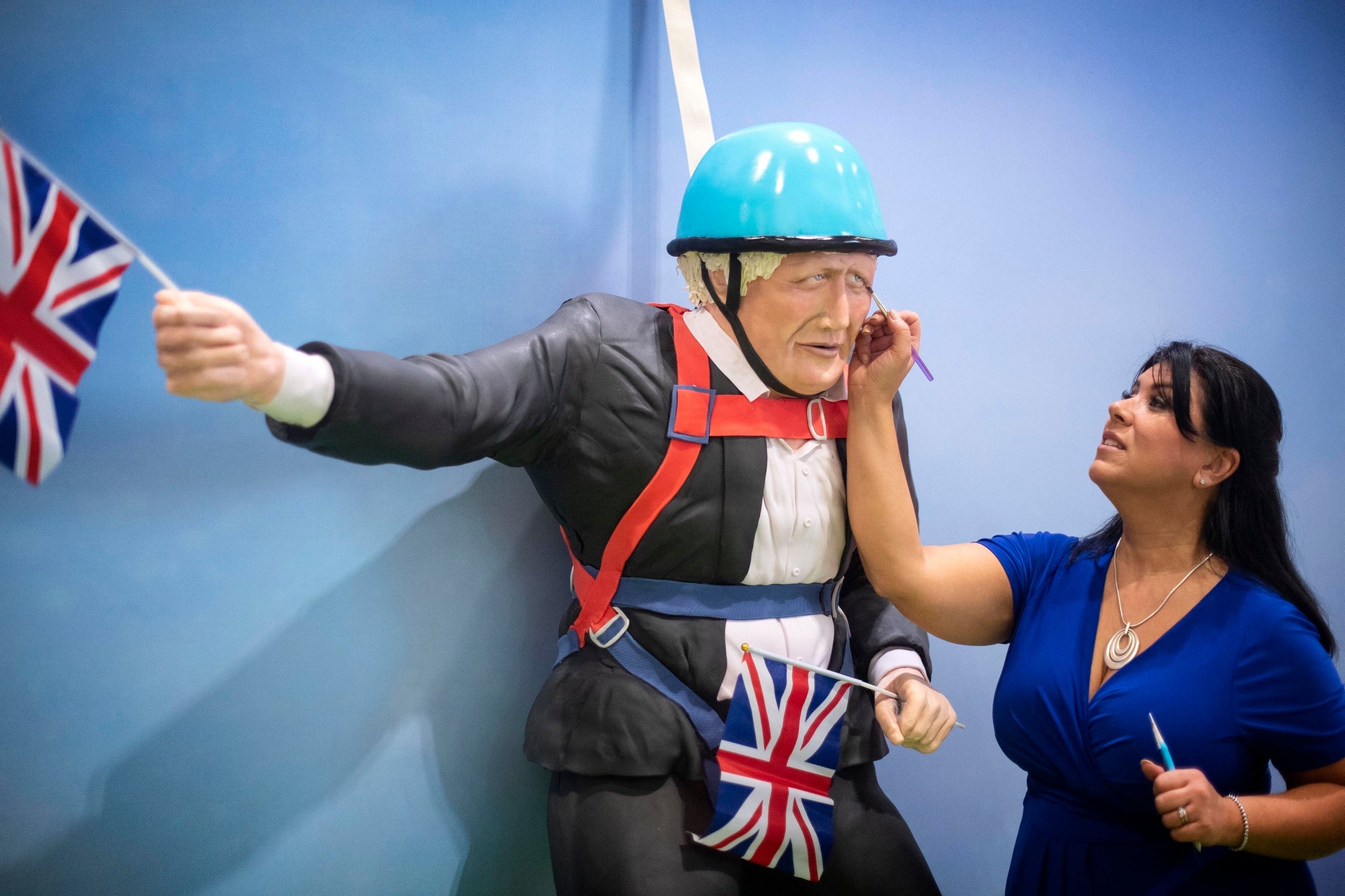 Cake maker Rosie Dummer makes the final touches to the life-sized Boris Johnson cake