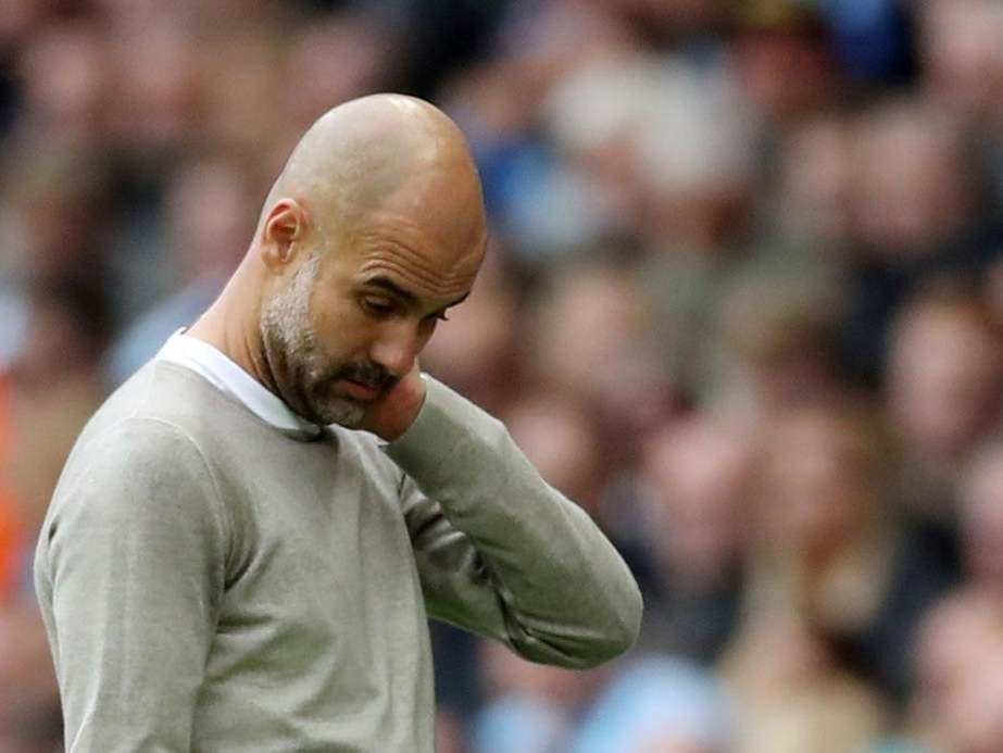 Pep Guardiola cuts a frustrated figure on the touchline