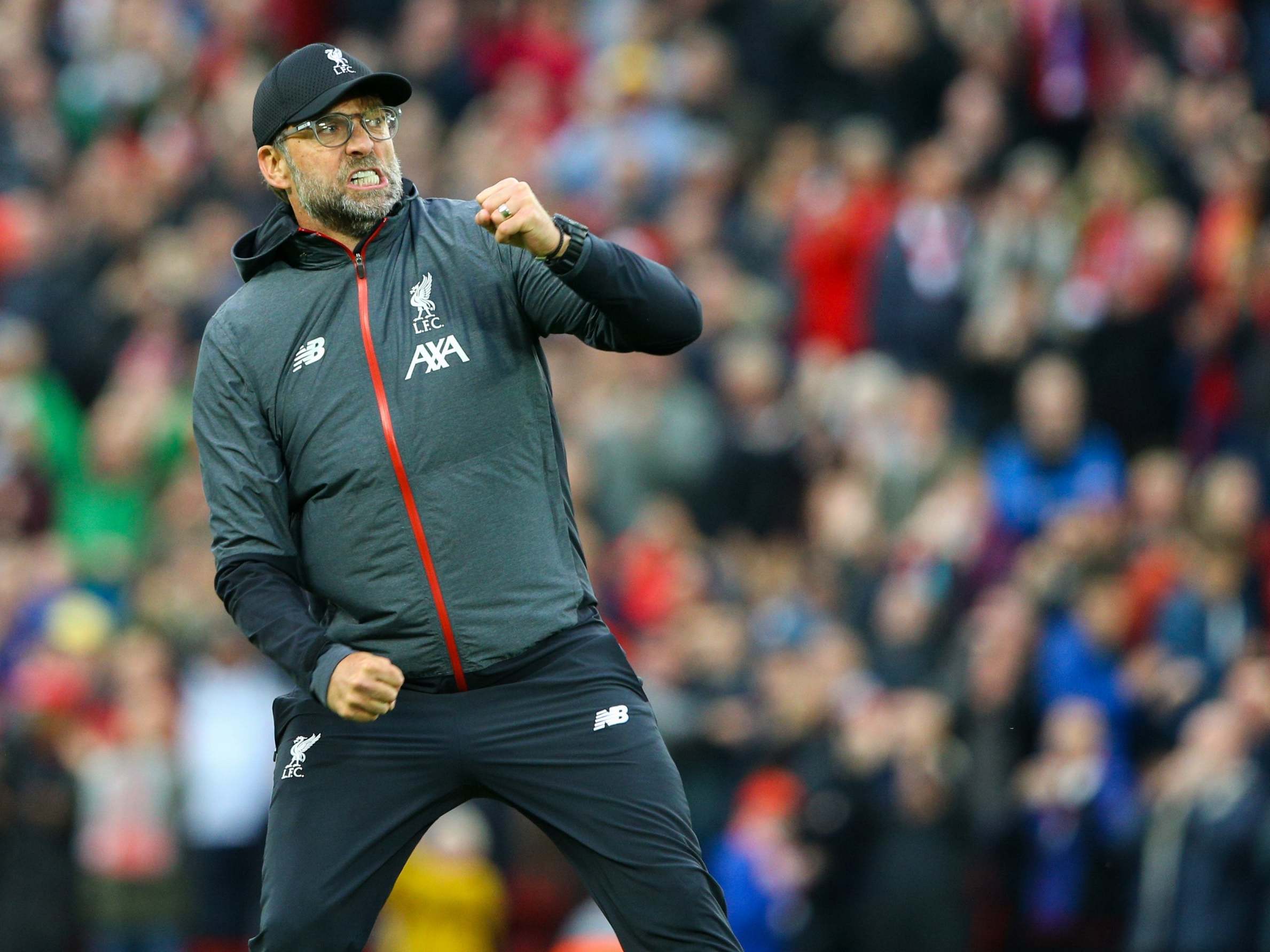 Jurgen Klopp celebrates in front of the Kop after defeating Leicester