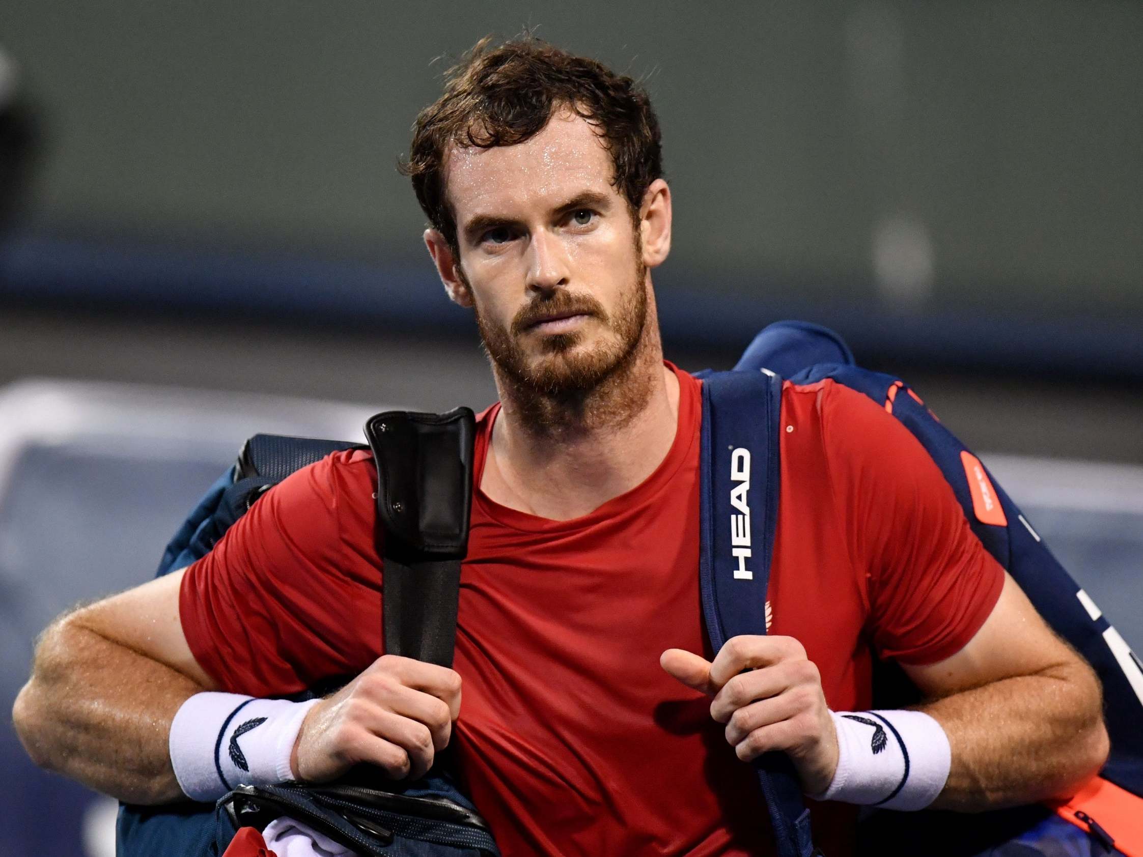 Andy Murray walks off the court in Shanghai after being defeated in the deciding tie-break