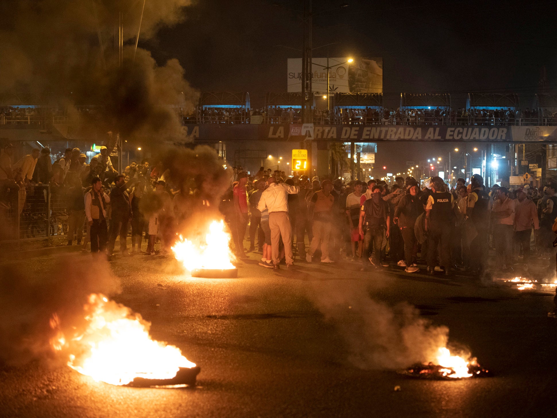 Demonstrators block the road during protests against austerity measures