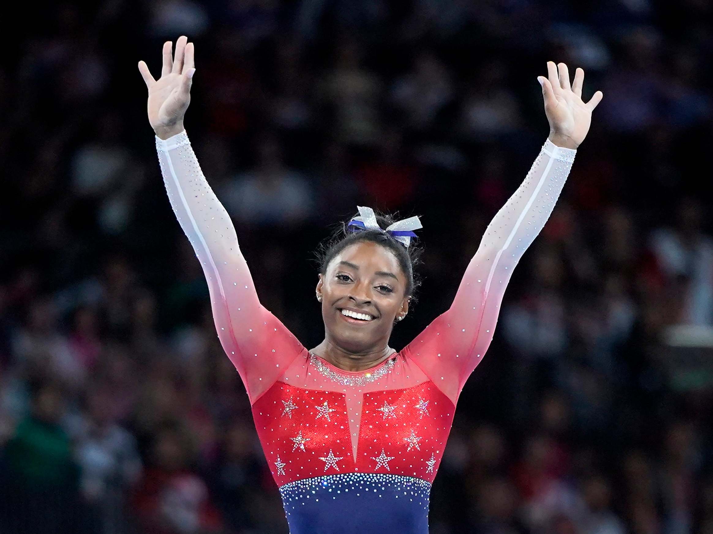 Simone Biles of USA celebrates after winning the women's team final