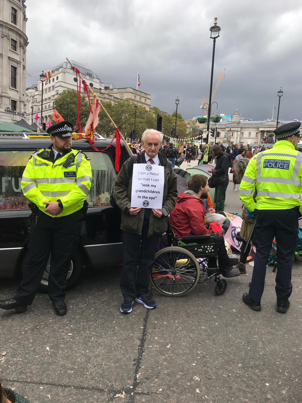 A man holds a sign at this week’s protests reading: ‘I am a rebel so that I can look my grandchildren in the eye’