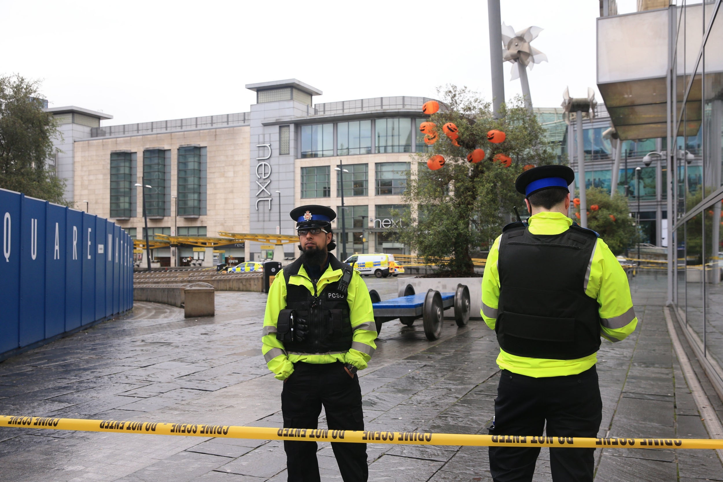 Police outside the Arndale Centre in Manchester after four people were stabbed in “random” attacks