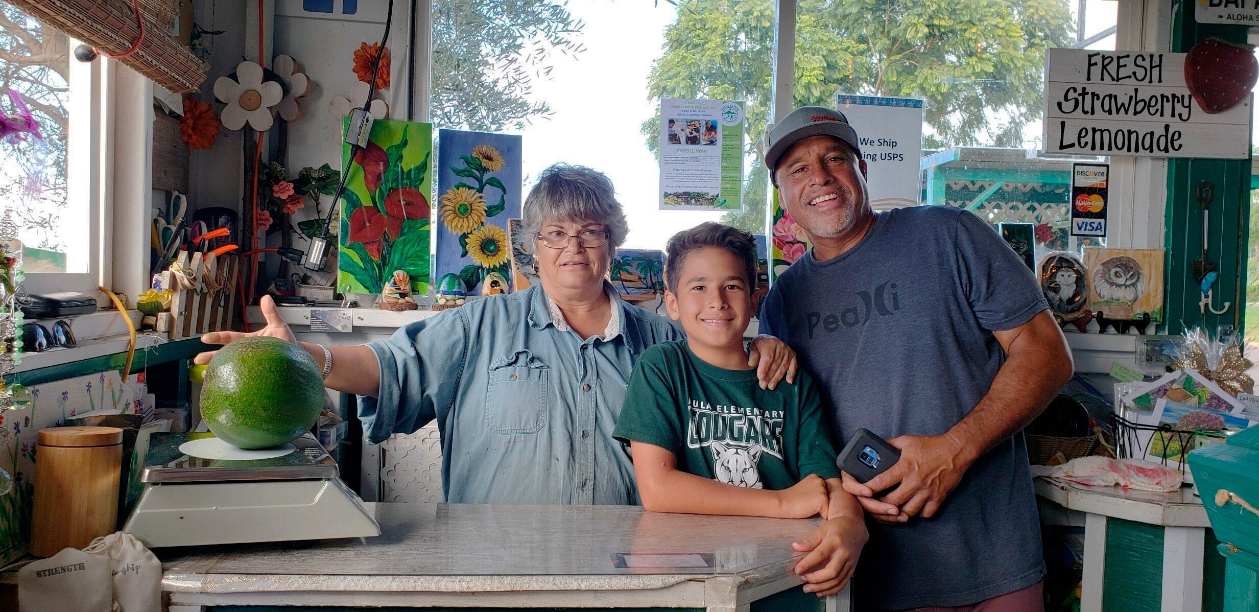 Kula Country Farms employee Meridyth Sealey, Lo’ihi Pokini and his father Mark Pokini conduct the first weigh in of the avocado on 13 December 2018