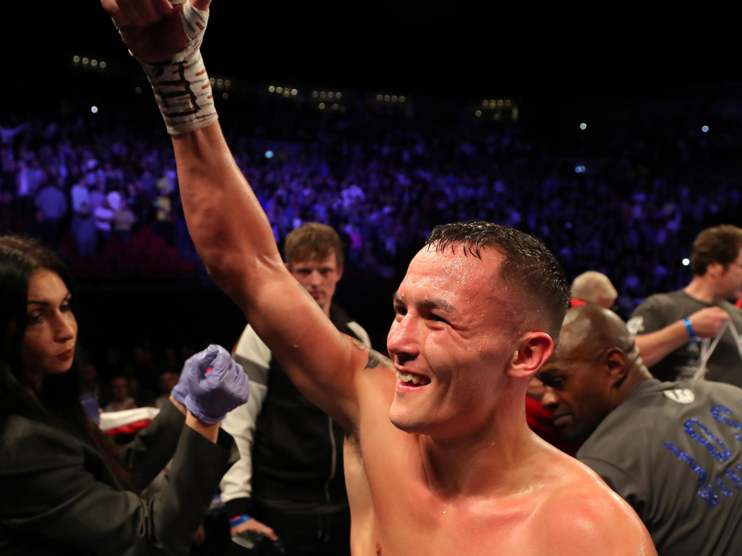 Josh Warrington celebrates his second-round knockout of Sofiane Takoucht