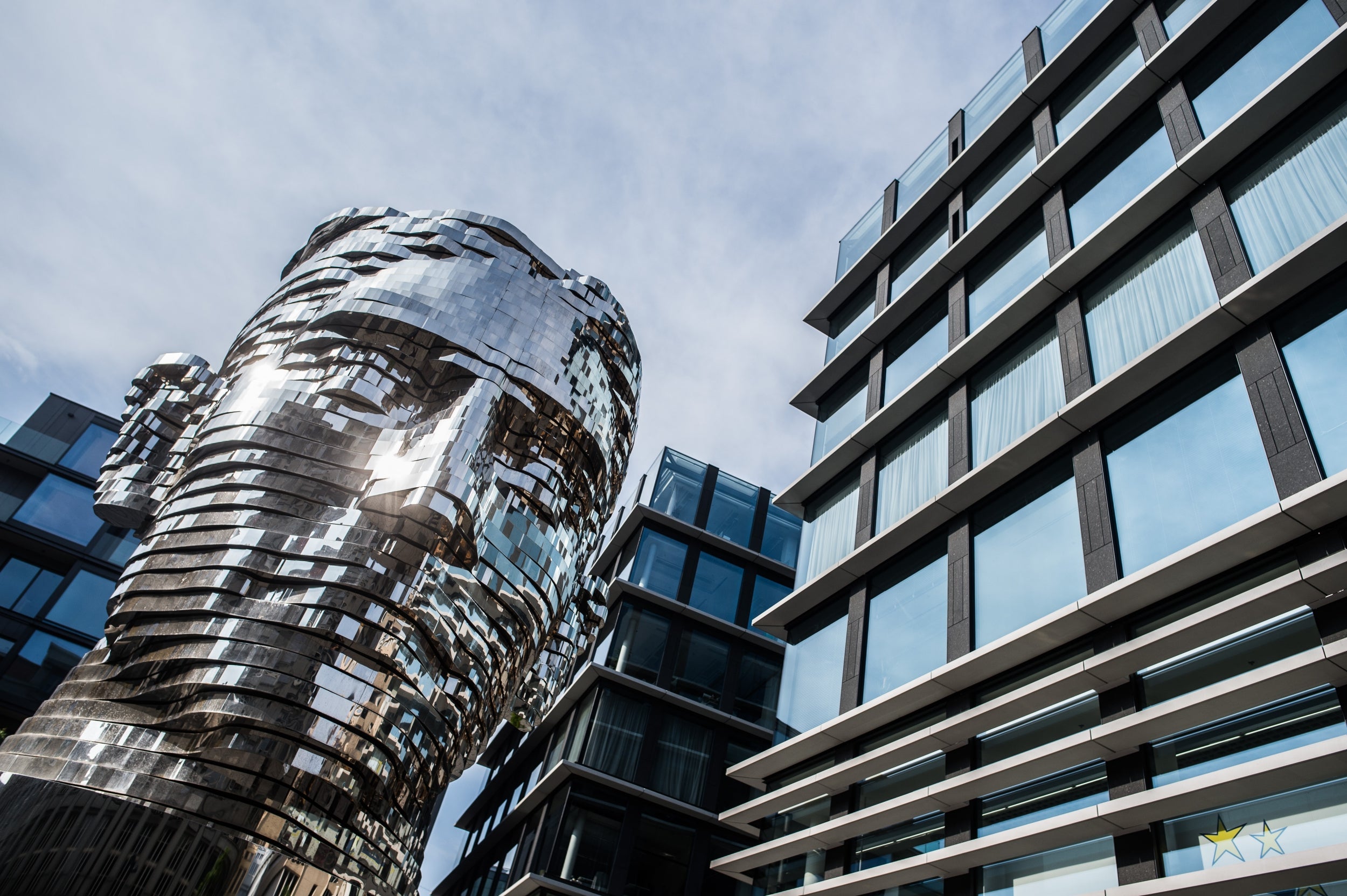 Erected directly above the Narodni trida metro station in November 2014, David Cerny’s 39-ton ‘Statue of Kafka’ has 42 mobile tiers which align to form the writer’s face