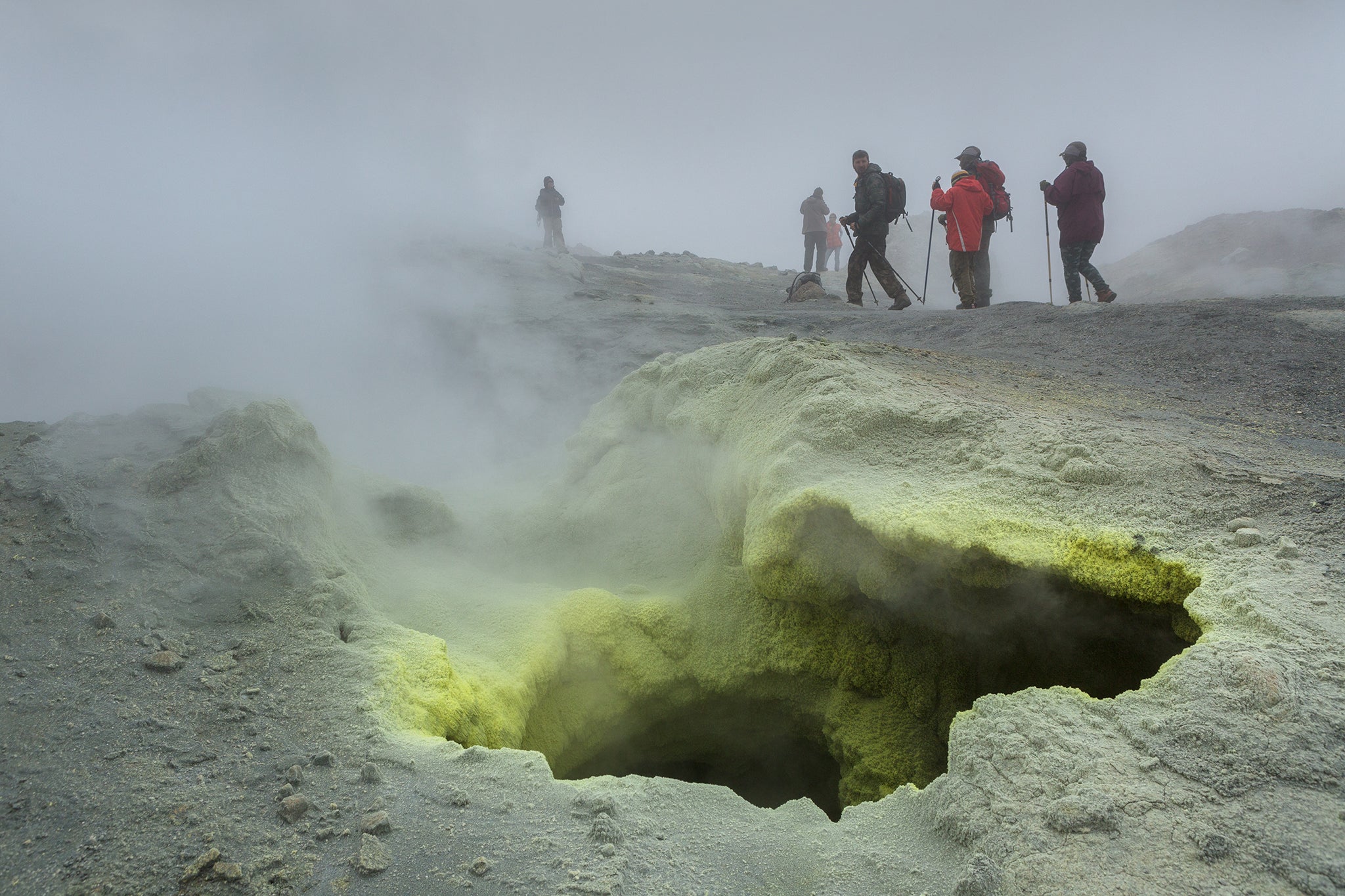 Tourists during the ascent to the active volcano Mutnovsky