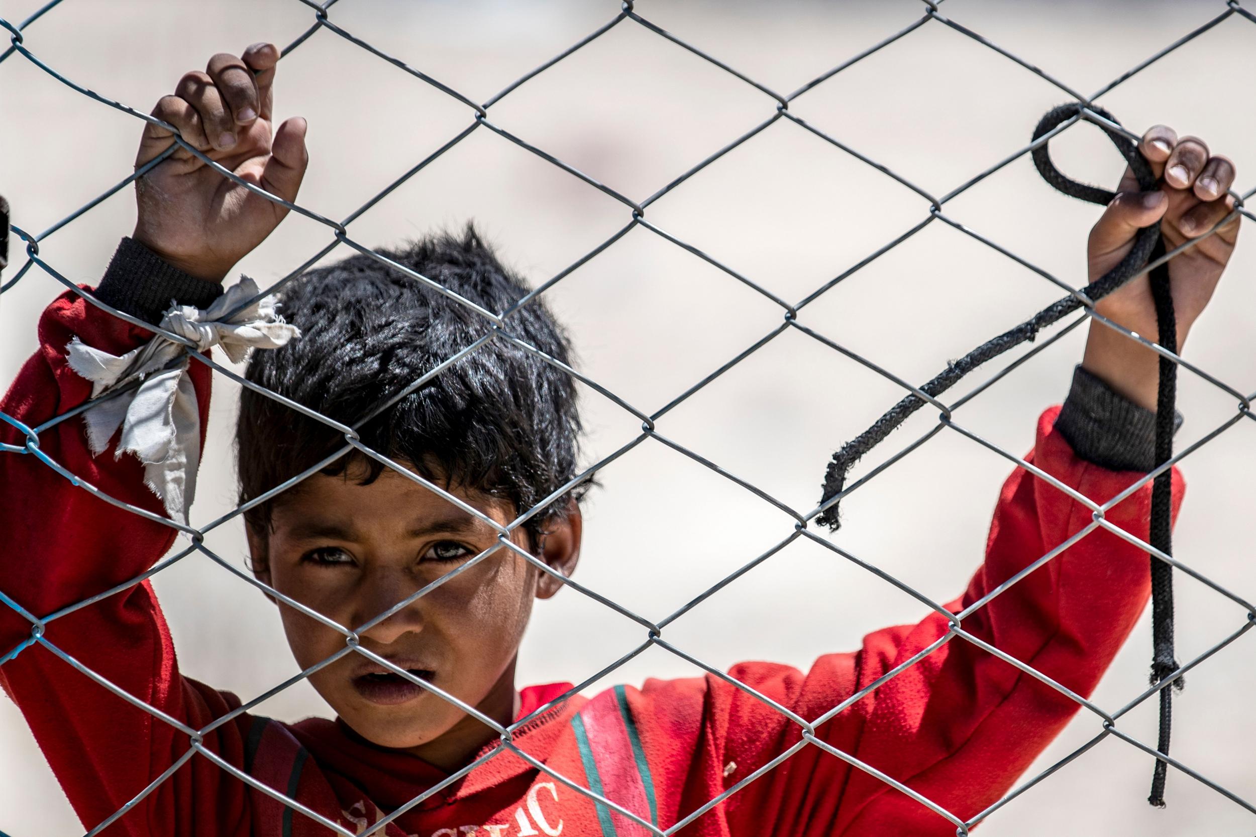 A Syrian child looks on in the al-Hol camp in al-Hasakeh governorate in northeastern Syria