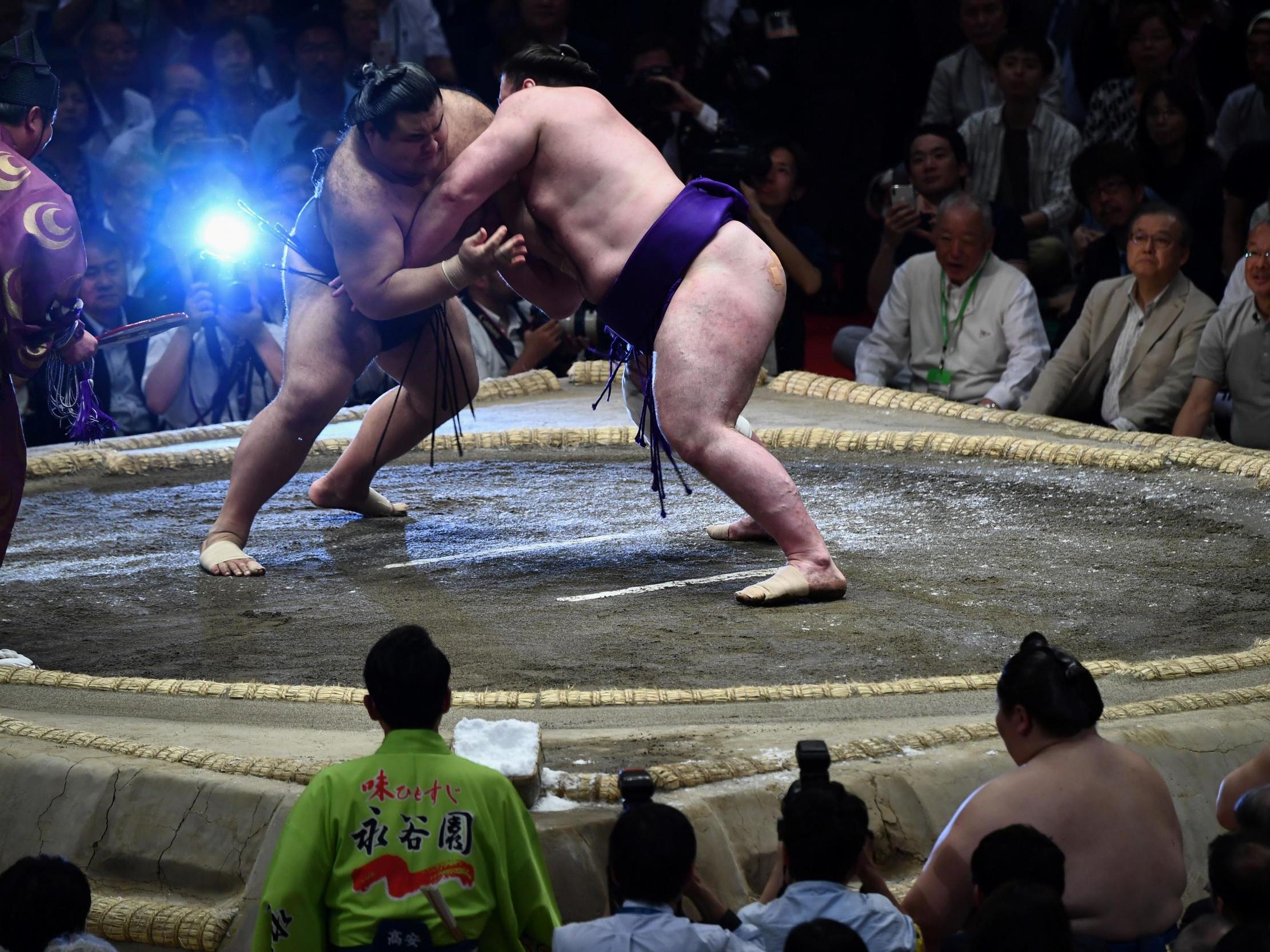 Sumo wrestlers in action during the Summer Grand Sumo Tournament in Tokyo last May