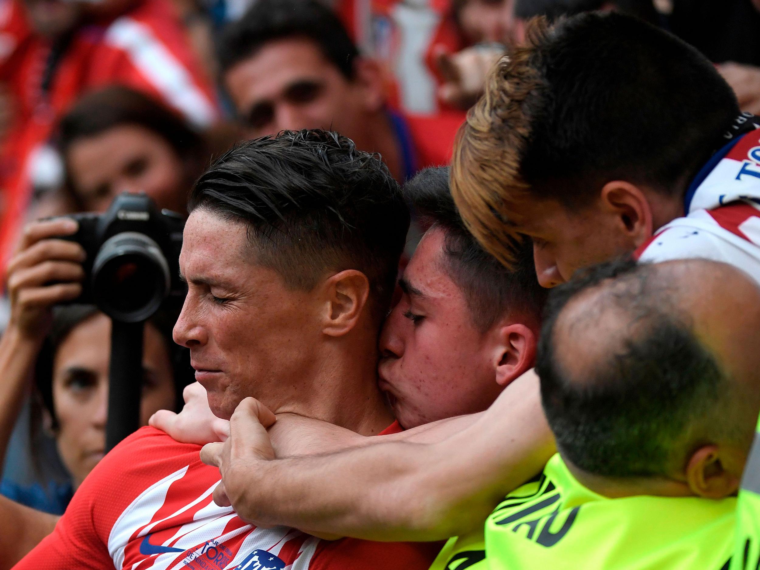 Torres celebrates scoring for Atletico in his final game for the club