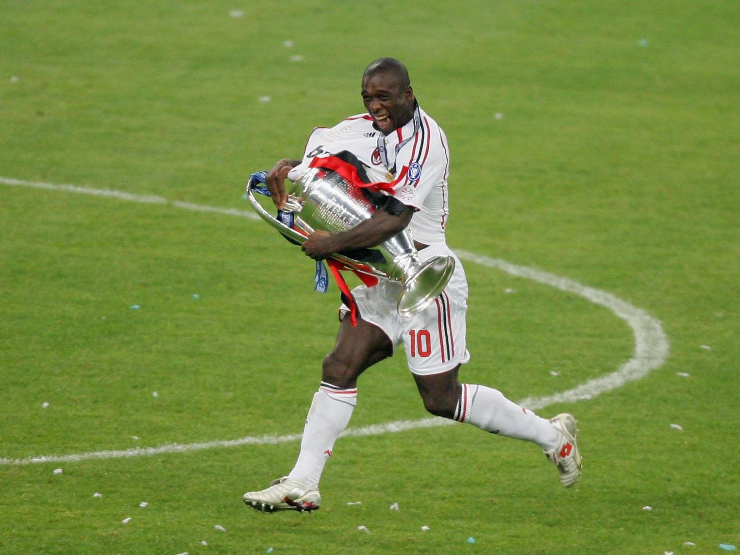 Seedorf runs away in delight with the Champions League trophy in Athens