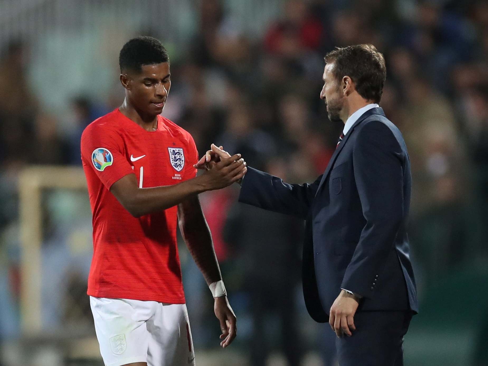 Marcus Rashford shakes hands with Gareth Southgate after the match