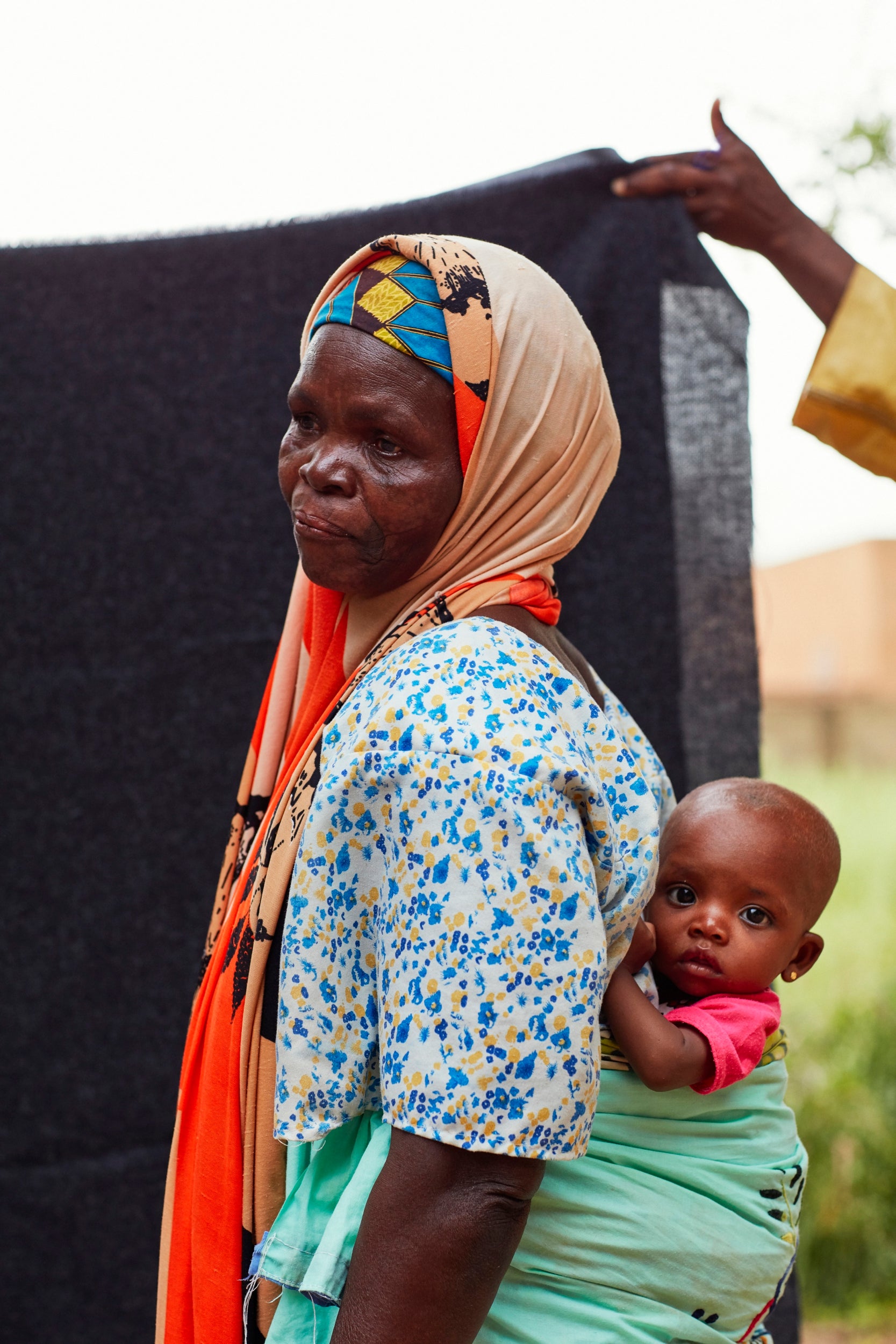 Six-month-old Aicka is struggling to gain weight. It’s been a month since her mother died and her grandmother Rabi has brought her to the Red Cross nutrition centre for help. The centre provides support to mothers and babies, weighing infants and measuring their upper arms for signs of malnutrition. 
The pair are two in a long queue waiting for help but a shortage of the nutrition supplement plumpy nut means that Aicka is still not at a healthy weight.
Rabi said: “I had been feeding her cassava flour but I noticed didn’t help her much. When she has plumpy nut it helps a lot but sometimes there isn’t any. It has made my life very hard to bear. You can’t take care of a child properly if your own life is not good.”