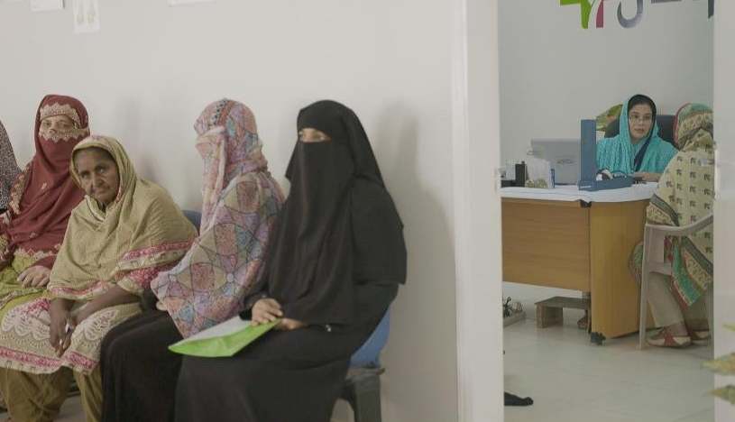 Rural female patients wait to be seen by a nurse at a Sehat Kahani clinic in Karachi (Matt Kay and Andrew Carver)