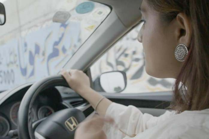 Dr Iffat Zafar, co-founder of Sehat Kahani, on her way to their first clinic in a low-income community in Karachi (Matt Kay and Andrew Carver)