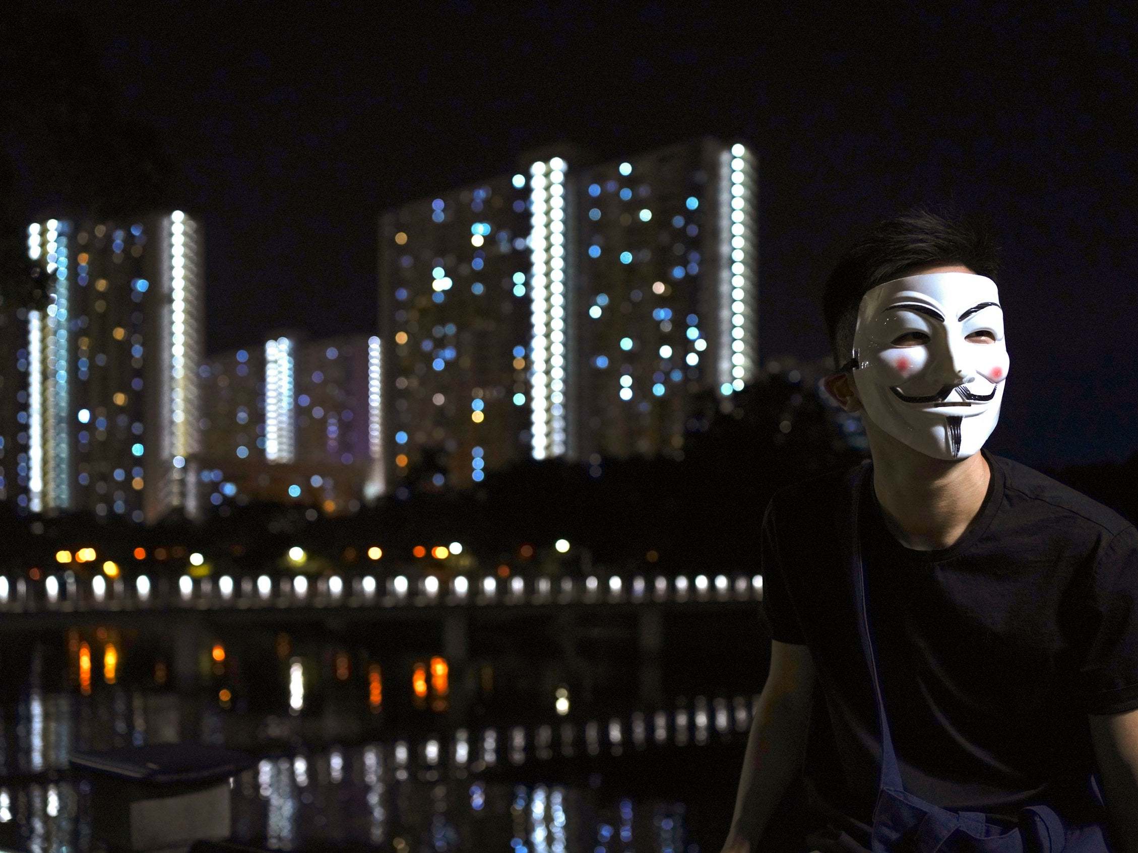 Pro-democracy protesters have been wearing black clothes and masks in Hong Kong (AP Photo/Vincent Wu)