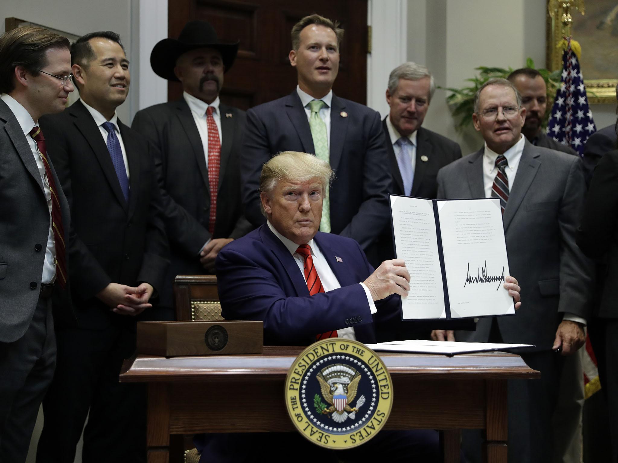 The president routinely makes a show of signing an order